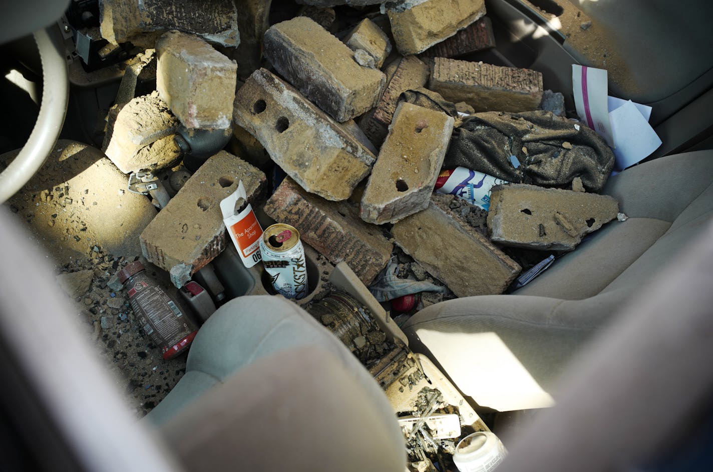 A car was smashed as part of a brick facade on a Minneapolis apartment building came crashing down late Tuesday. The Red Cross is helping 15 people who are now without a place to live. The building is owned by Stephen Frenz, the much-criticized landlord who faces a class action lawsuit from former tenants.] Richard Tsong-Taatarii &#xef; richard.tsong-taatarii@startribune.com