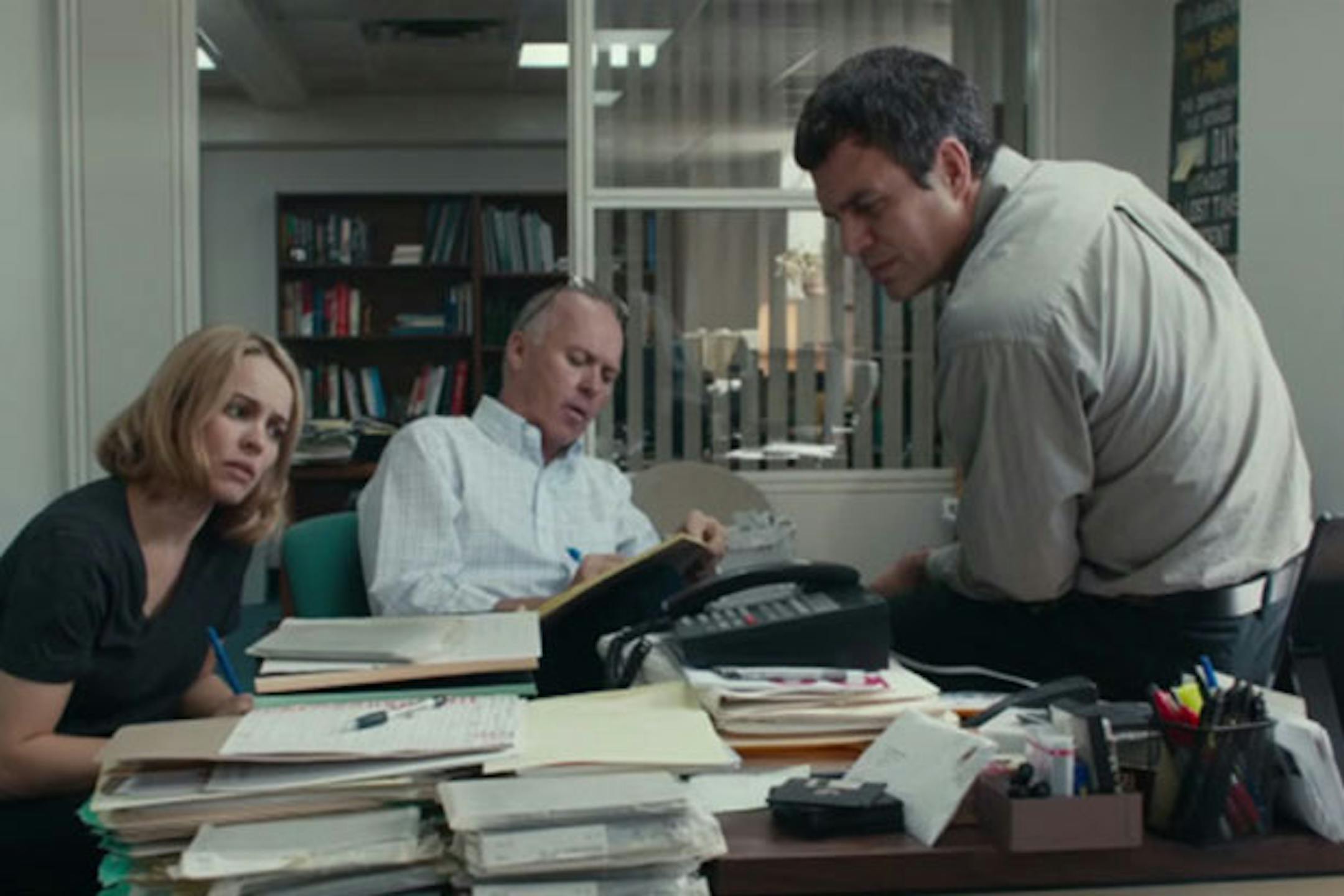In "Spotlight," Gary Galone as Jack Dunn, right, is confronted by Michael Keaton as Boston Globe editor Walter Robinson and Rachel McAdams portraying Globe reporter Sacha Pfeiffer.