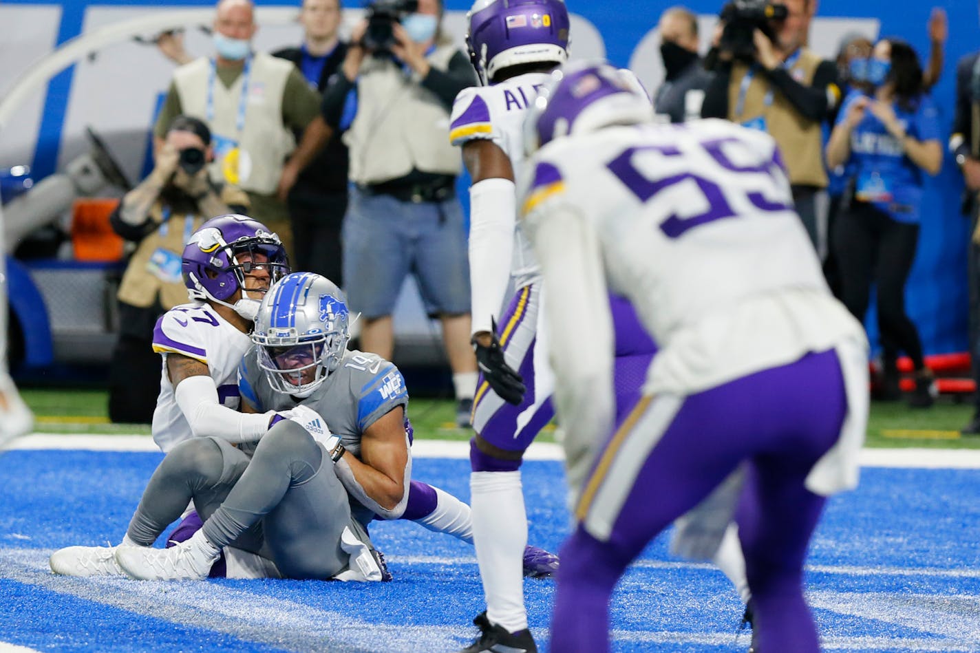 Detroit Lions wide receiver Amon-Ra St. Brown (14), defended by Minnesota Vikings cornerback Cameron Dantzler (27) catches a 11-yard pass for a touchdown to end the NFL football game, Sunday, Dec. 5, 2021, in Detroit. (AP Photo/Duane Burleson)