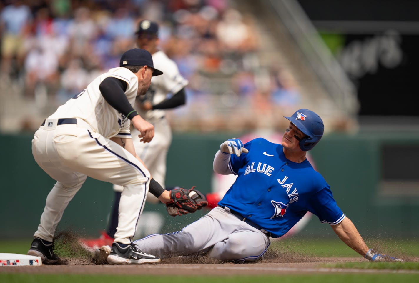 Toronto Blue Jays third baseman Matt Chapman (26) was out at third as Minnesota Twins third baseman Kyle Farmer (12) made the tag for the second out of a double play in the seventh inning. The Minnesota Twins lost 3-0 to the Toronto Blue Jays in an MLB baseball game Sunday afternoon, May 28, 2023 at Target Field in Minneapolis. ] JEFF WHEELER • jeff.wheeler@startribune.com