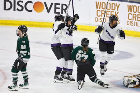Minnesota forward Liz Schepers, center, is congratulated by teammate Sophie Jaques after Schepers scored a goal against Boston on Wednesday.