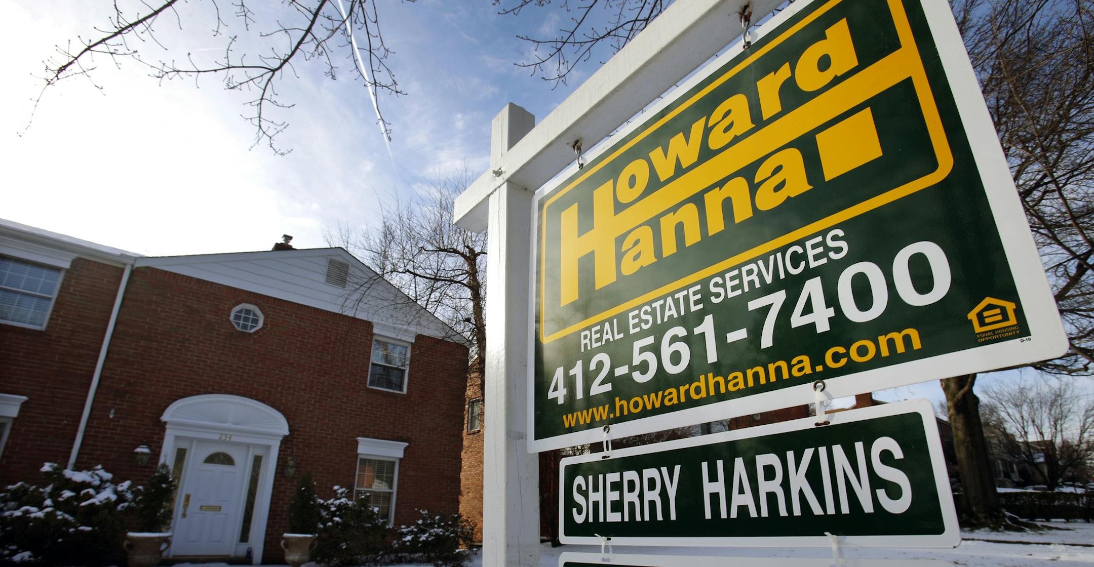 In this Thursday, Jan. 9, 2014, photo, a for sale sign is placed in front of a house in Mount Lebanon, Pa. Standard & Poor's releases S&P/Case-Shiller index of home prices for November, on Tuesday, Jan. 28, 2014. (AP Photo/Gene J. Puskar) ORG XMIT: MIN2014021312390260