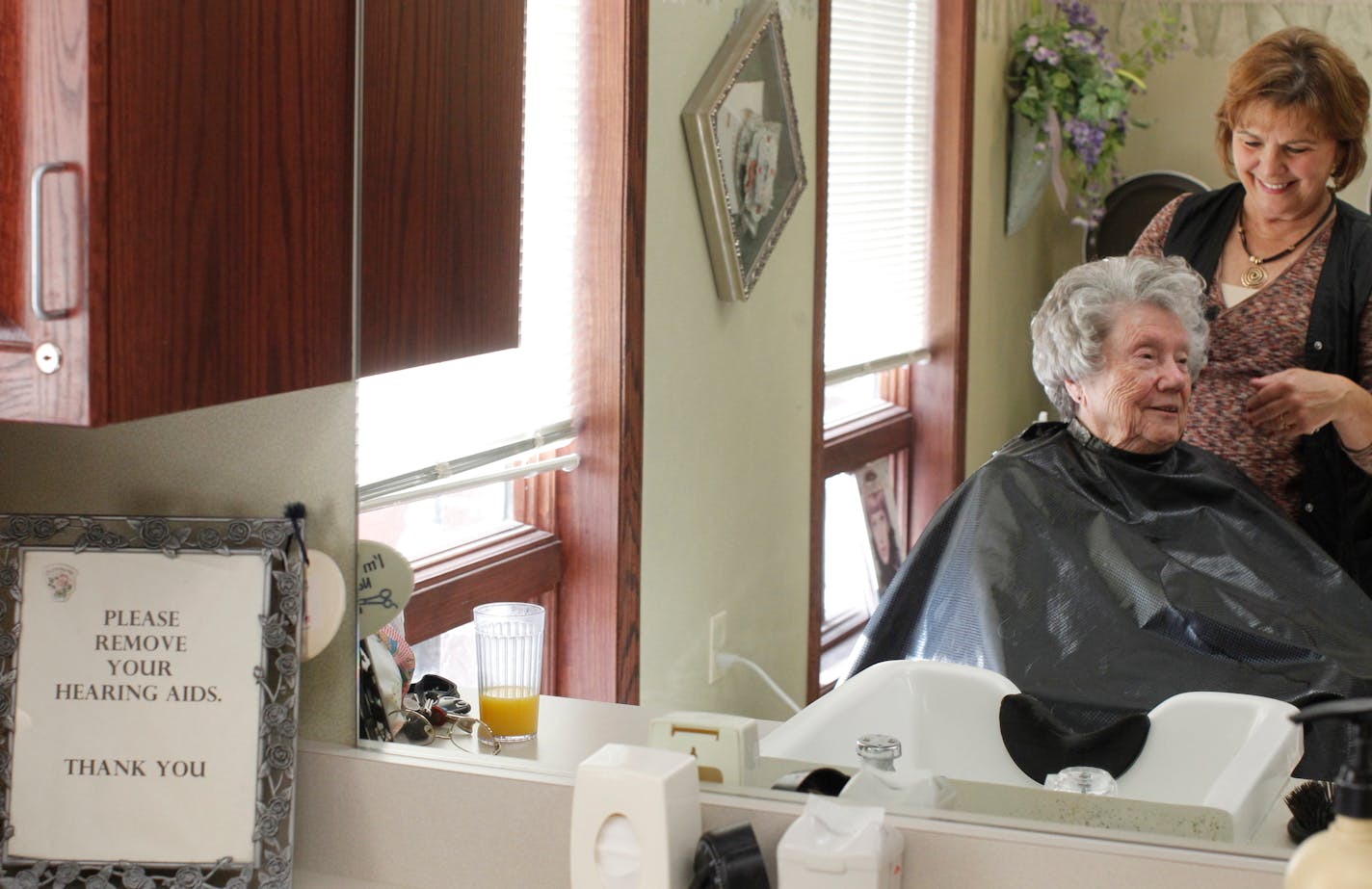 Friendly faces: Reggie Stone worked on Sue Alexander's hair at the salon at Boutwell Landing in Oak Park Heights. A trend in the senior housing industry is building complexes that include housing as well as such amenities as salons, grocery stores and theaters.