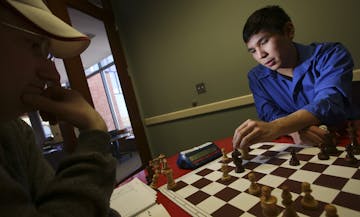 Chess Grandmaster Wesley So played chess with Sean Nagle at the Ridgedale Public Library on Friday, February 27, 2015 in Minnetonka, Minn. ] RENEE JON