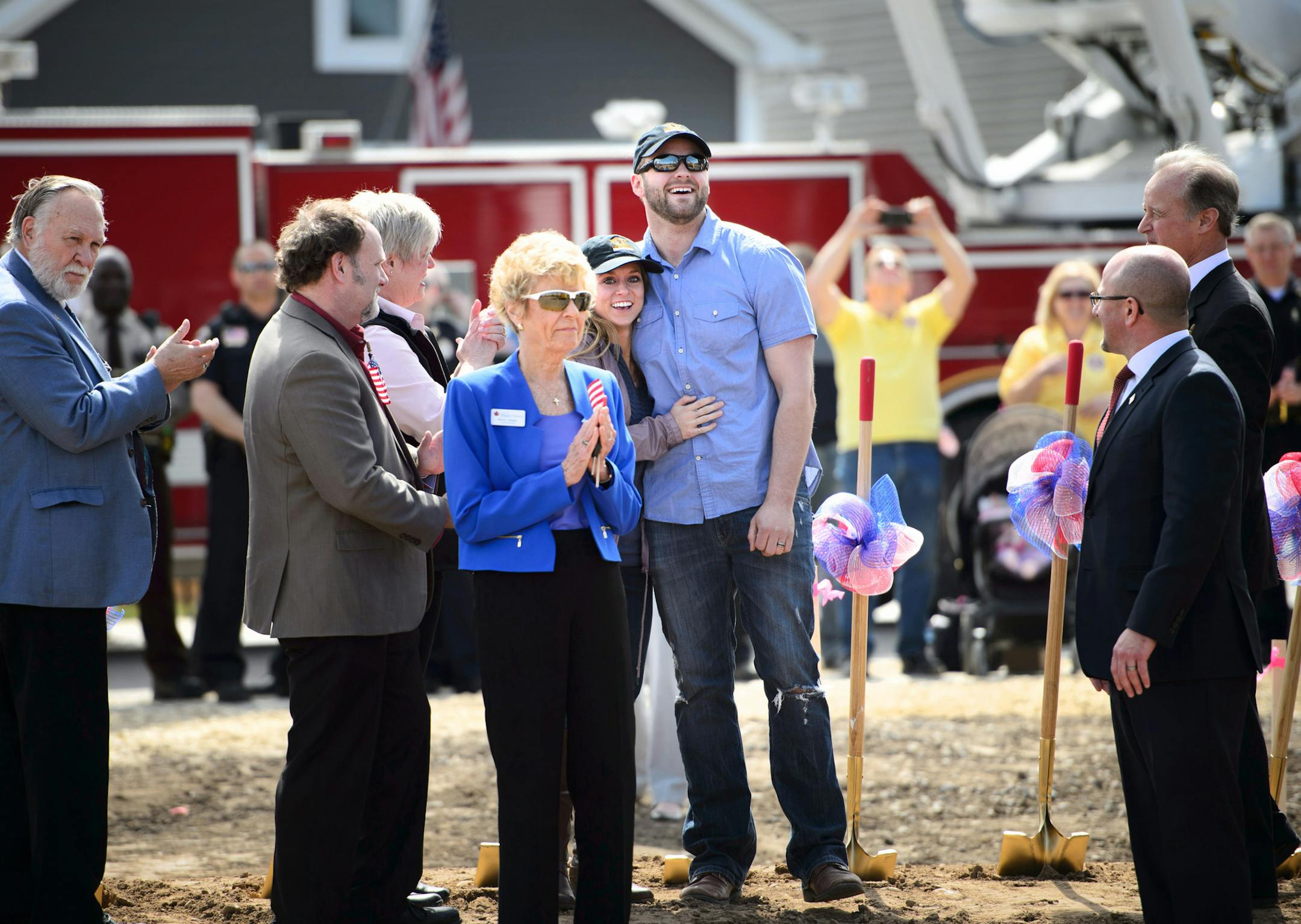 Megan and Andrew watched as a backhoe dug a hole symbolizing the start of their new home. ] GLEN STUBBE * gstubbe@startribune.com Wednesday, April 15, 2015 PulteGroup surprised a Minnesota Air National Guard veteran Andrew Walker and his wife Megan with the news that they will receive a new, mortgage-free home Maple Grove as part of PulteGroup’s Built to Honor program, which donates mortgage-free homes to wounded veterans and their families across the country in partnership with Operation