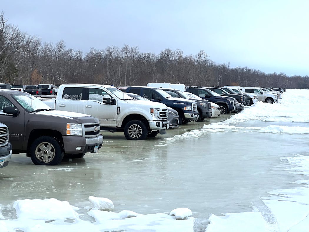 Scores of day anglers who accessed Upper Red Lake the weekend of Dec. 10-11 by ATVs parked their pickups on the ice near shore. The weight created water on top of the ice that posed some risk to the vehicles.