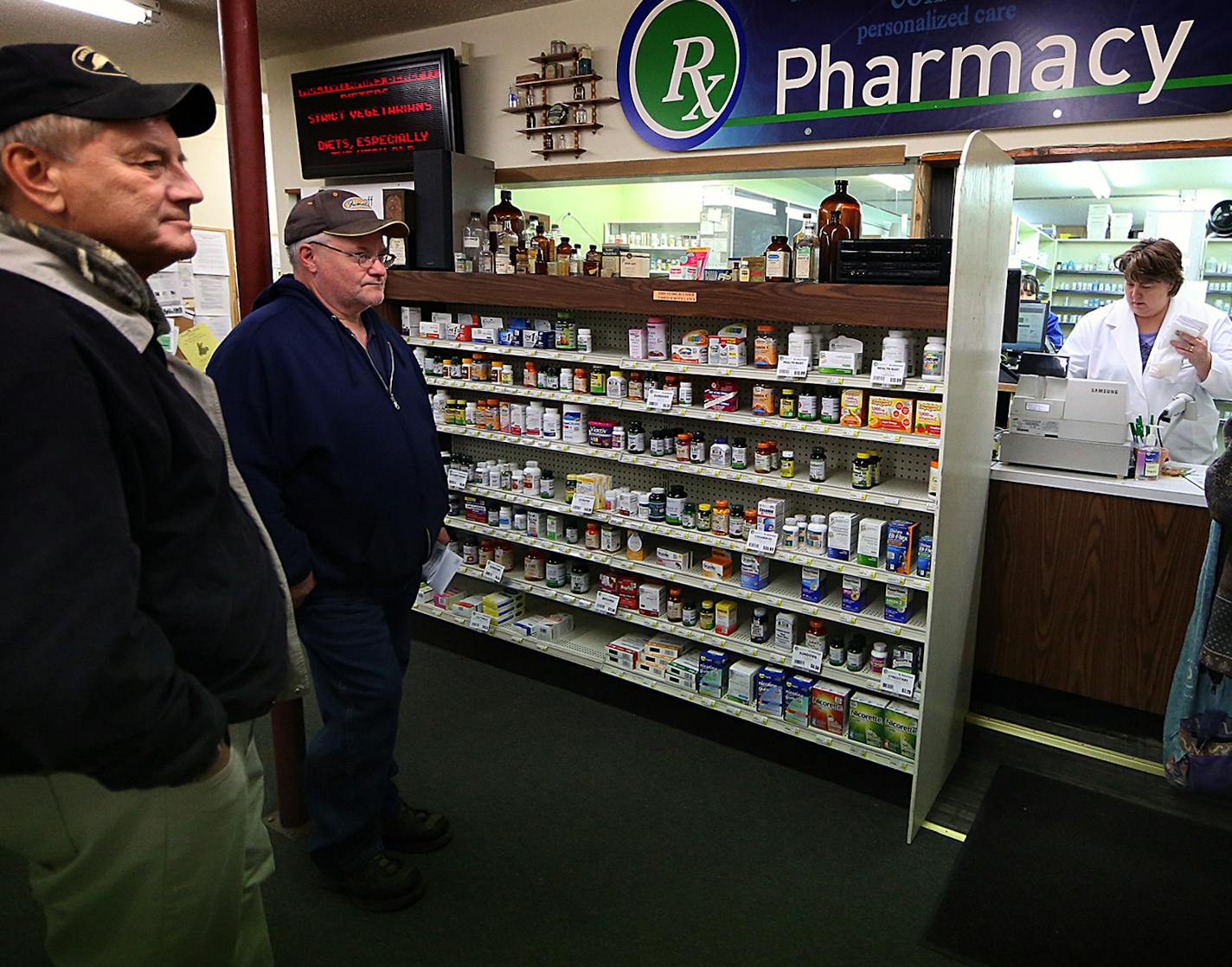 Kris Thompson filled prescriptions and waited on customers at the Lake Country Drug and Gifts store in Isle. Thompson owns the store and is also a pharmacist. ] JIM GEHRZ &#xef; james.gehrz@startribune.com /Isle, MN / March 23, 2016 2:30 PM - BACKGROUND INFORMATION: Small box stores with "dollar" in their names are changing the landscape of rural Minnesota: building like gangbusters, often in towns too small for a WalMart. Dollar General, for instance, opened 42 stores in Minnesota in the past t