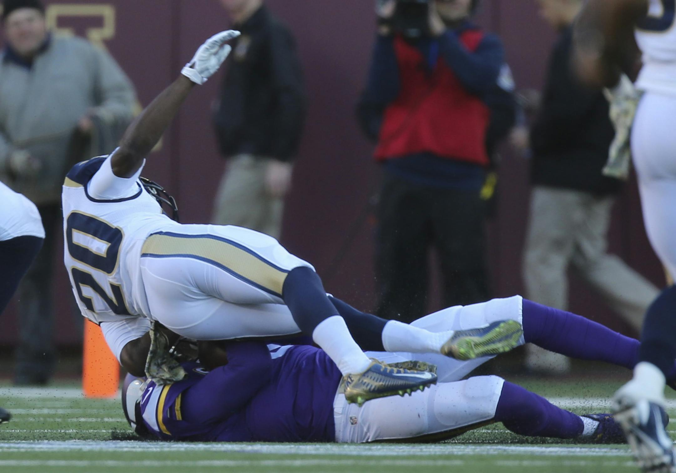 Vikings quarterback Teddy Bridgewater scrambled for a five yard gain before being hit hard by Rams cornerback Lamarcus Joyner (20) as he slid to the ground in the fourth quarter Sunday afternoon. Joyner was penalized for unnecessary roughness on th play. Bridgewater left the game after the hit.