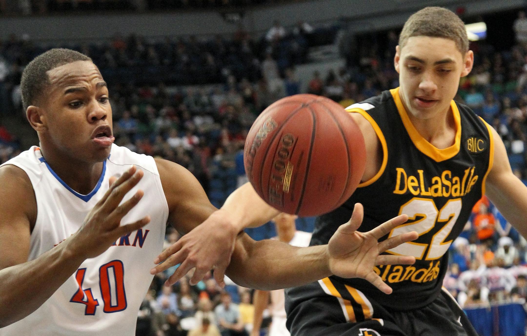 Class 3A Boys Prep Basketball Championship - DeLaSalle vs. Minneapolis Washburn. Washburn's Joseph Doby (40) and DeLaSalle's Reid Travis (22) fought for control of a rebound. (MARLIN LEVISON/STARTRIBUNE(mlevison@startribune.com