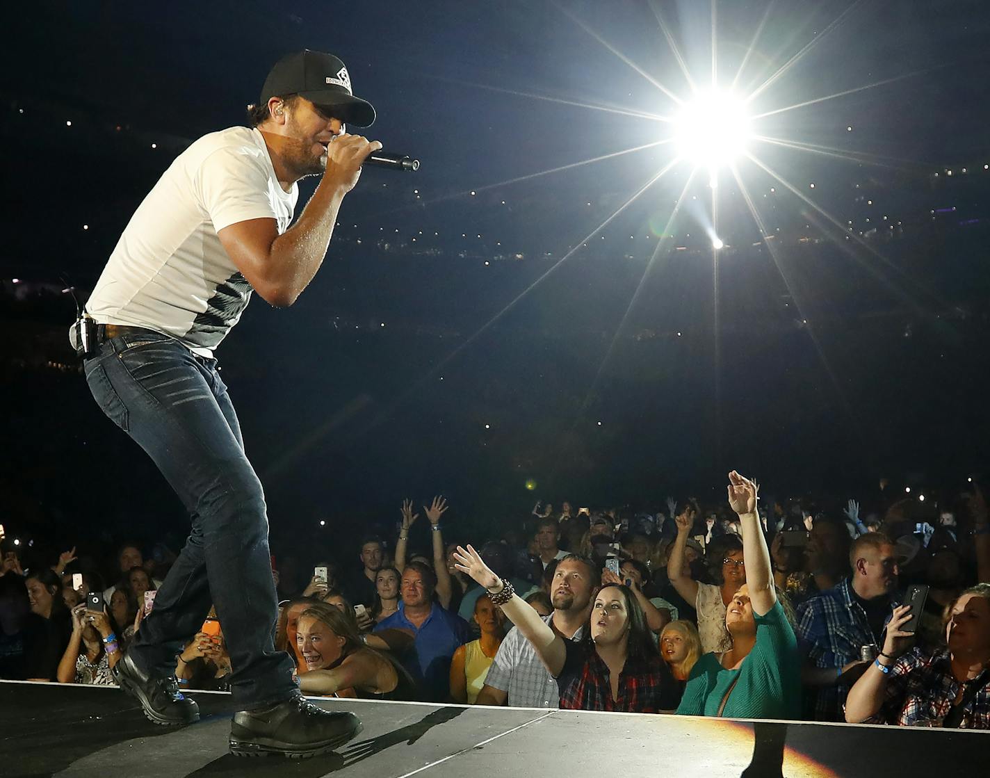 Country hunk Luke Bryan showed infectious energy and plenty of his signature butt wiggle Friday in the inaugural concert at U.S. Bank Stadium.