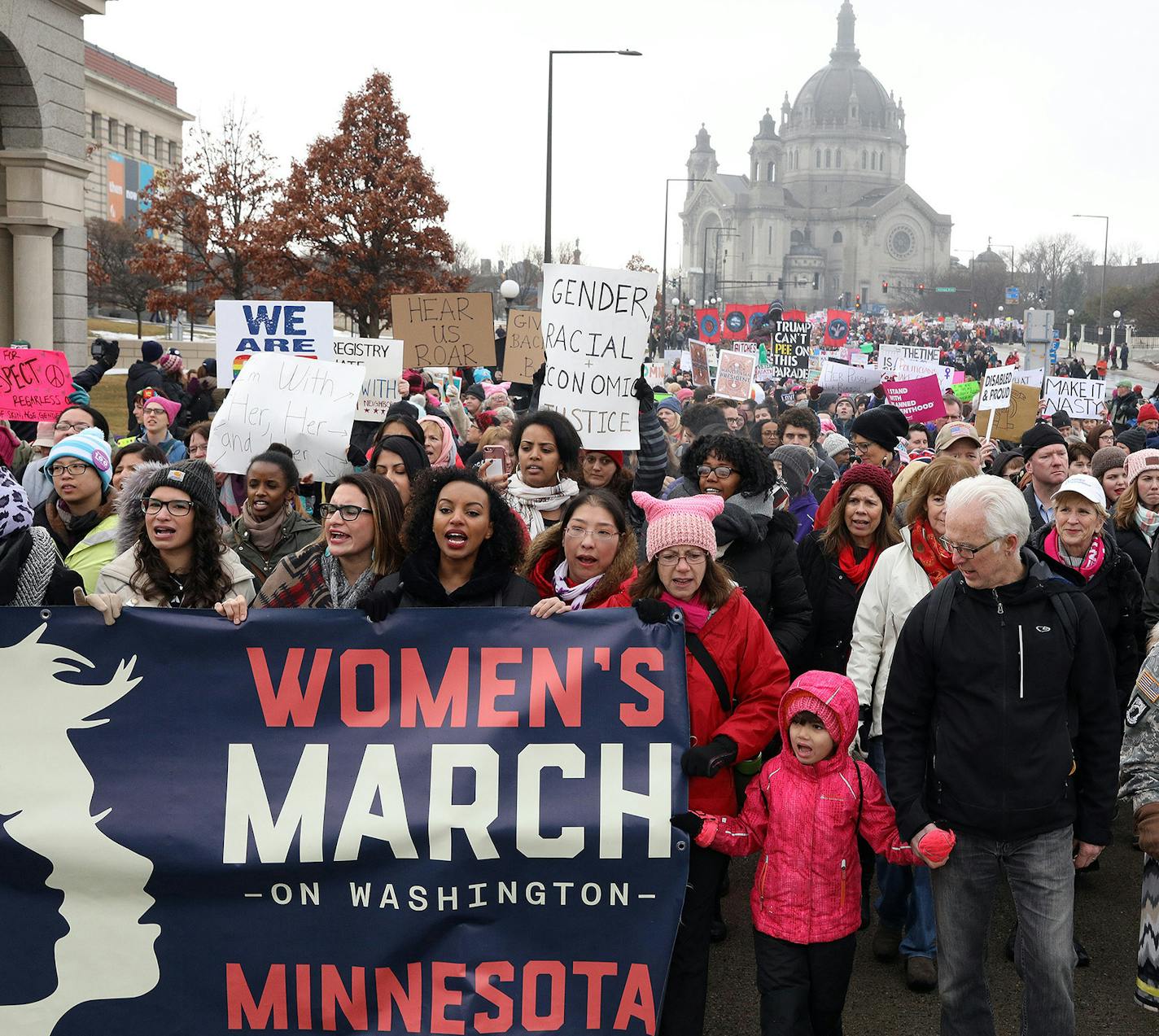 A young girl stood front and center at the front of the procession from St. Paul College to the State Capitol for the noon rally. ] ANTHONY SOUFFLE &#x2022; anthony.souffle@startribune.com Women's activists and supporters gathered at St. Paul College then marched to the State Capitol for a noon rally Saturday, Jan. 21, 2017 for a local version of the big national D.C. women's march. ORG XMIT: MIN1701211543353332 ORG XMIT: MIN1702021240461179