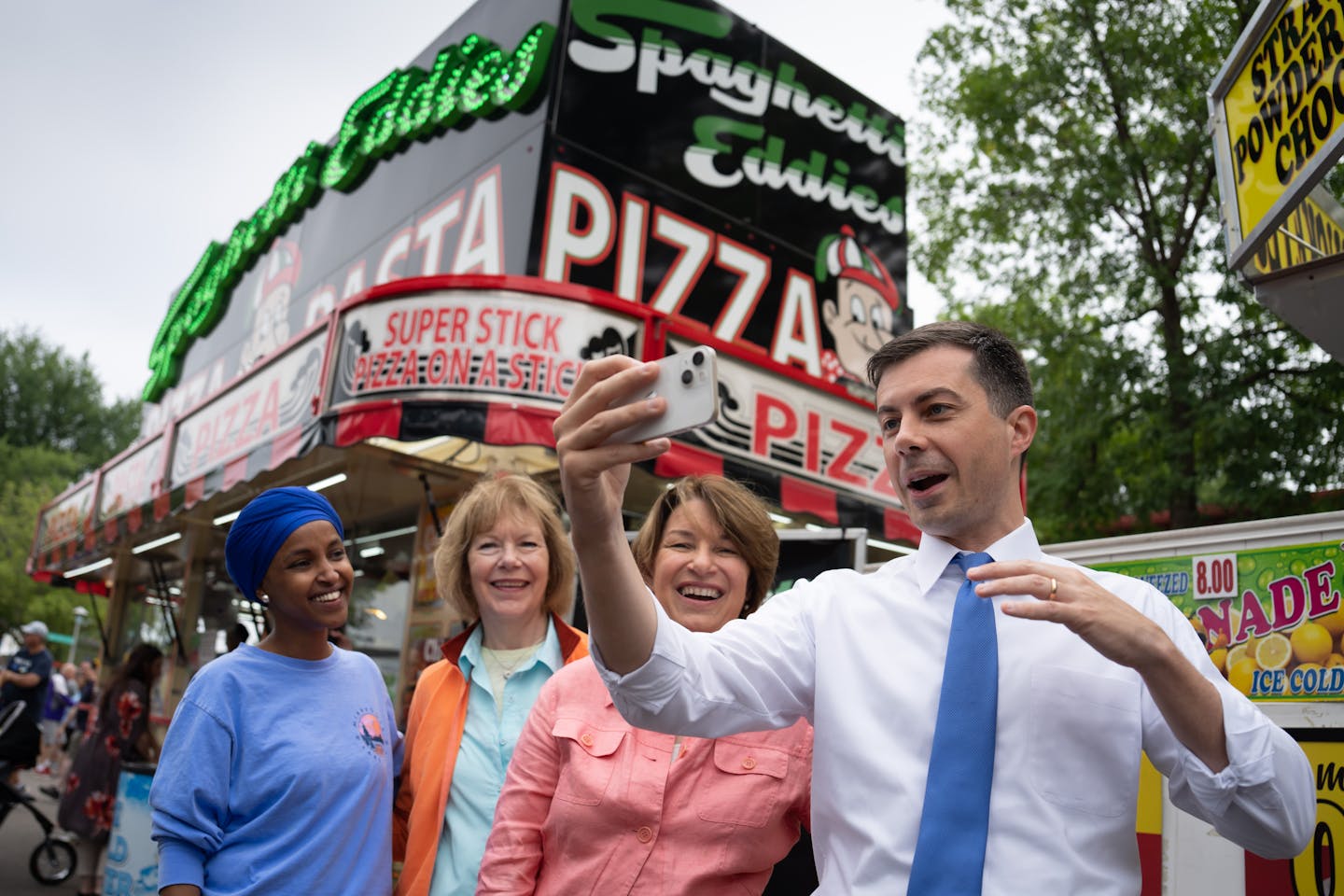 U.S. Transportation Secretary Pete Buttigieg did a live video chat as he toured the Minnesota State Fair with Rep. Ilhan Omar, Sen. Tina Smith, and Sen. Amy Klobuchar Thursday, Aug. 25, 2022, Falcon Heights, Minn. U.S. Transportation Secretary Pete Buttigieg, on a four-day tour of six states to highlight infrastructure projects funded with federal dollars in the Biden administration's infrastructure act.