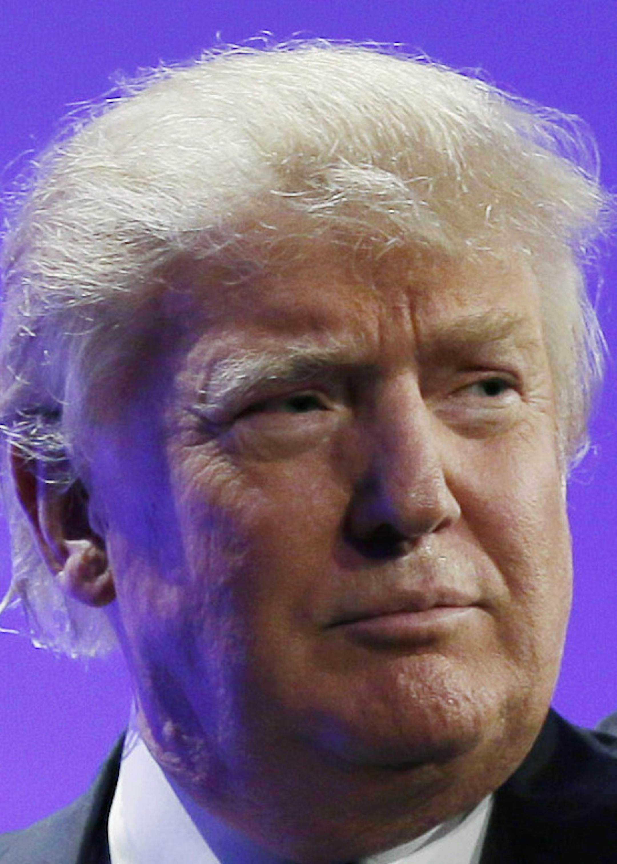 Donald Trump waves as he walks off stage after speaking at the Iowa Republican Party's Lincoln Dinner, Saturday, May 16, 2015, in Des Moines, Iowa. (AP Photo/Charlie Neibergall)