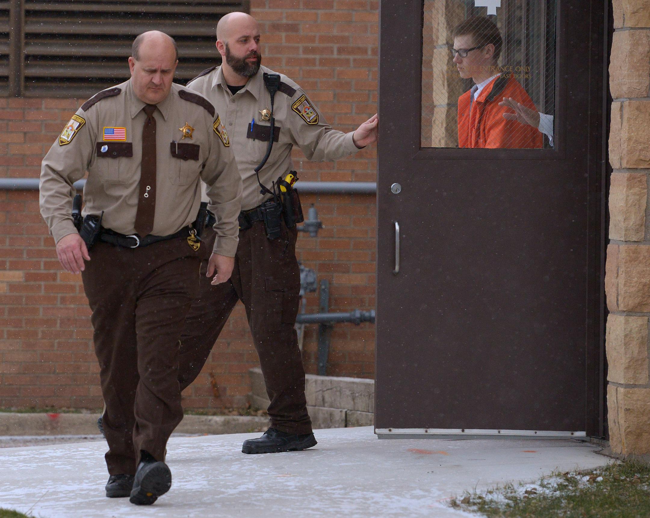 John LaDue is escorted back to the Waseca Sheriff's Office from the Waseca County Courthouse Friday morning following a hearing regarding a secure facility in Atlanta, Georgia secure facility refusing to treat him for his autism spectrum disorder and violent fantasies. ] (SPECIAL TO THE STAR TRIBUNE/BRE McGEE) **John LaDue (orange jumpsuit)
