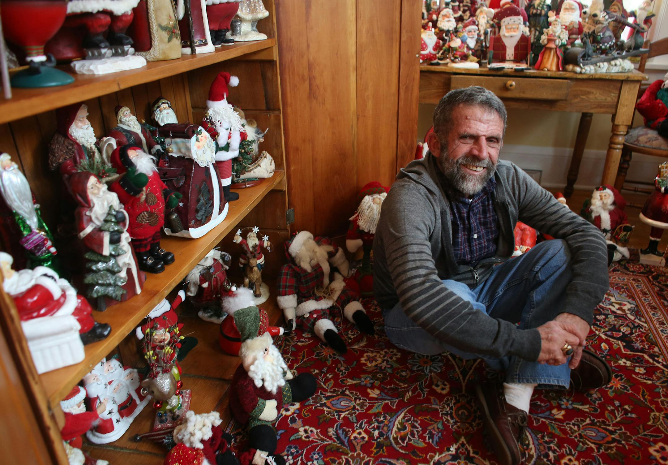 Dan Cashman has collected more than 1,000 Santa with very little duplicates and they come from all across the world. ] (KYNDELL HARKNESS/STAR TRIBUNE) kyndell.harkness@startribune.com Cashman's home in south iMinneapolis , Min., Friday, December 5, 2014.