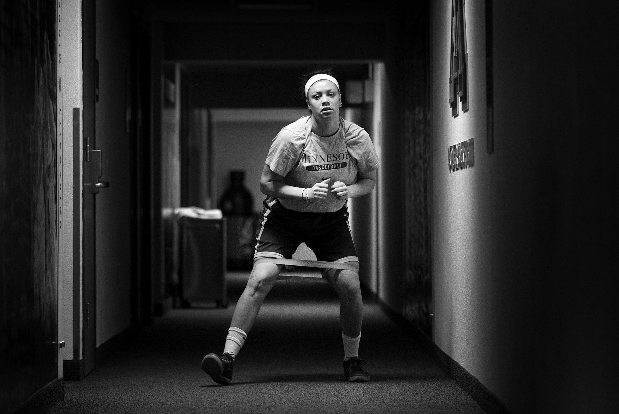 Rachel Banham worked out her legs during a rehabilitation session in a lower level hallway inside of Williams Arena on May 13, 2015.