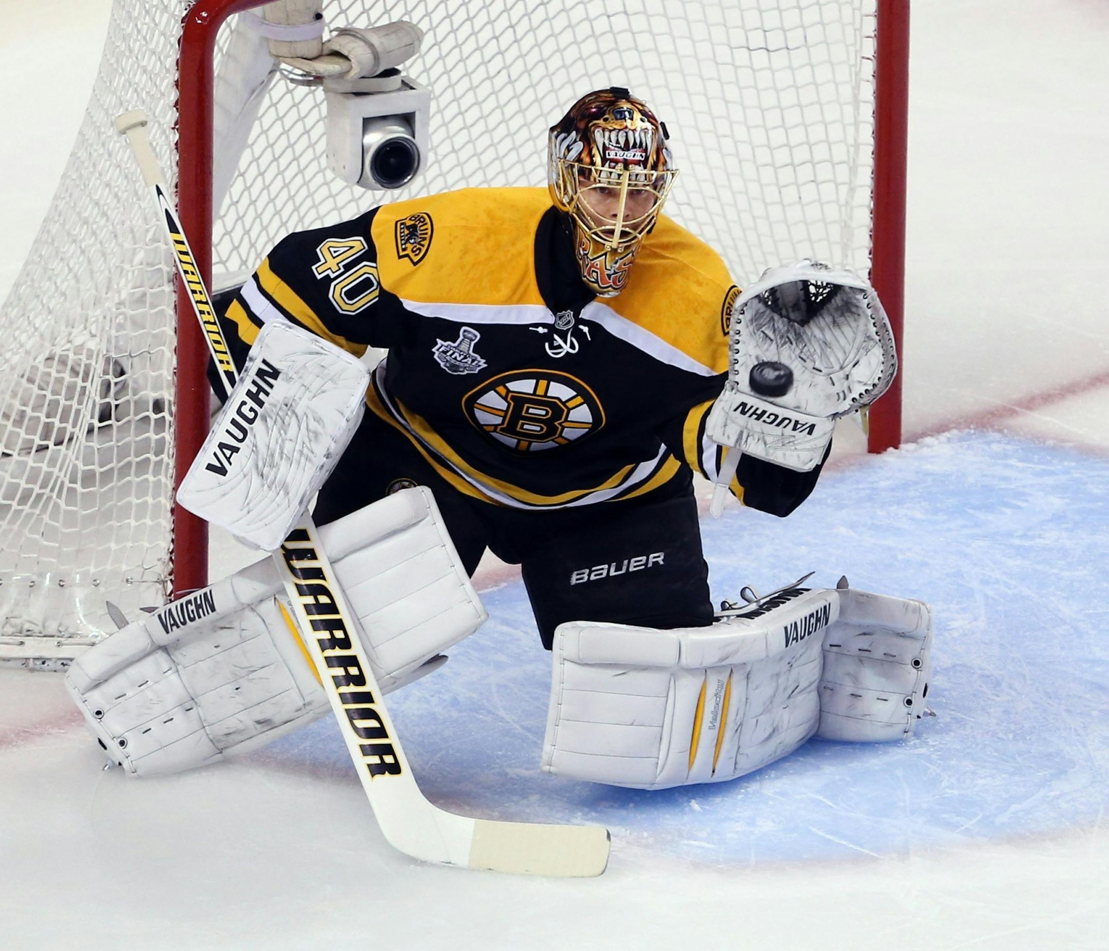 Boston Bruins goalie Tuukka Rask (40) makes a save during the first period in Game 3 of the Stanley Cup Finals against the Chicago Blackhawks at the TD Garden in Boston, Massachusetts, Monday, June 17, 2013.