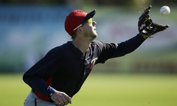 Twins outfielder Clete Thomas pulled down a catch during spring training in Fort Myers.