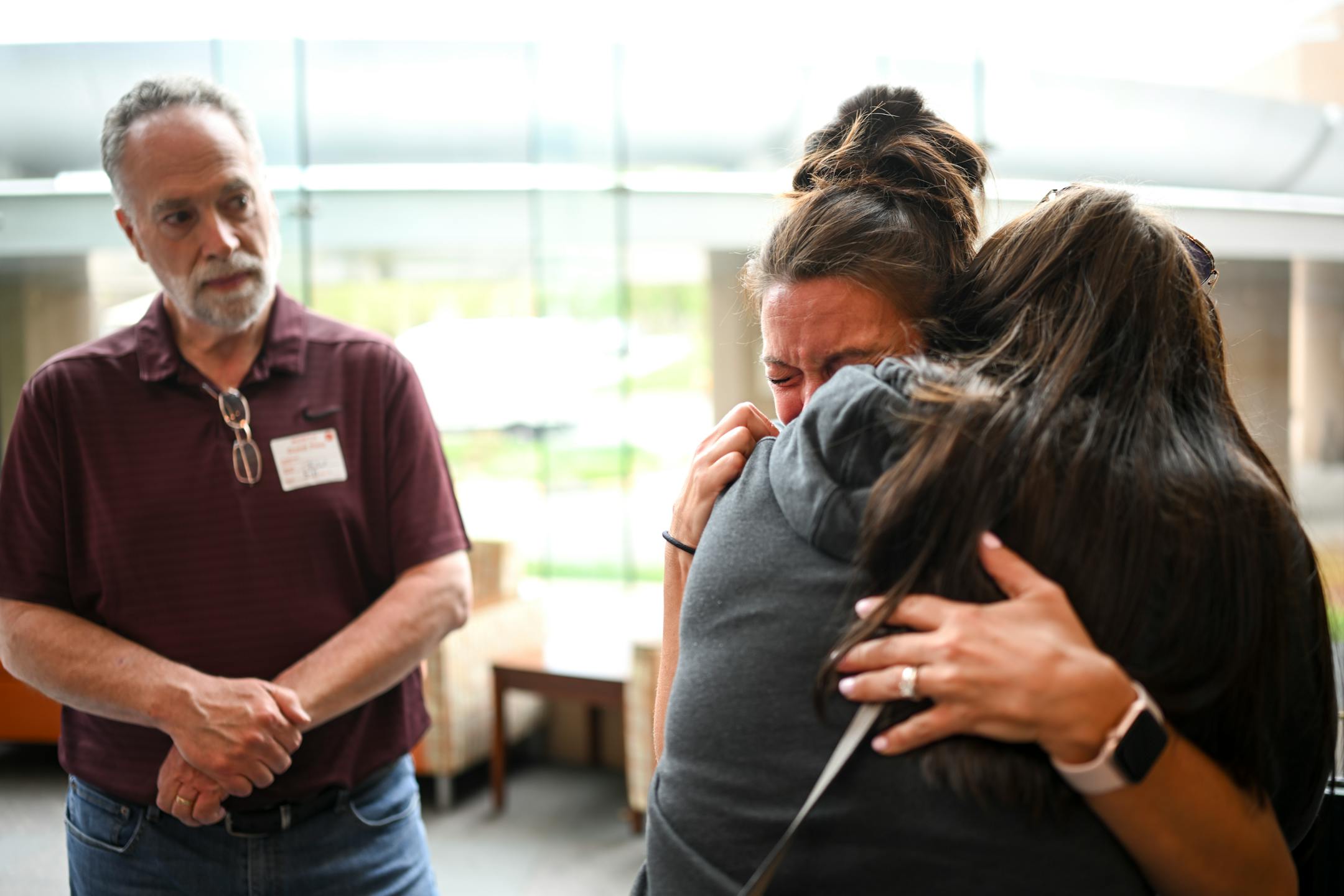 Critical Care Nurse Holly Vilione is embraced by Alyssa Mueller as she's overcome with grief recounting the COVID patients she lost in her unit Thursday, May 11, 2023, at North Memorial Health Hospital in Robbinsdale, Minn.