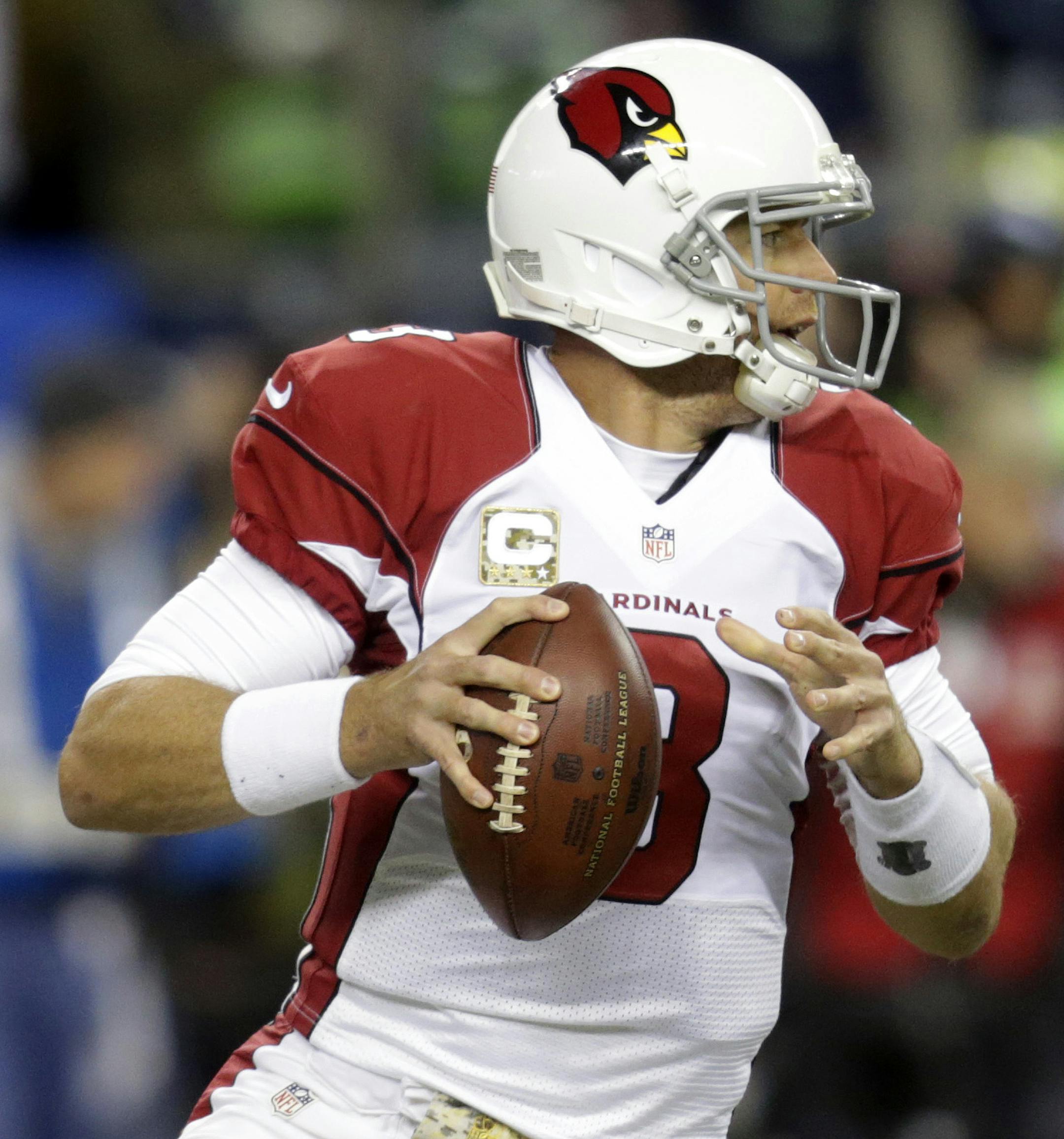 Arizona Cardinals quarterback Carson Palmer looks to pass in the first half of an NFL football game against the Seattle Seahawks, Sunday, Nov. 15, 2015, in Seattle. (AP Photo/Stephen Brashear) ORG XMIT: SEA106