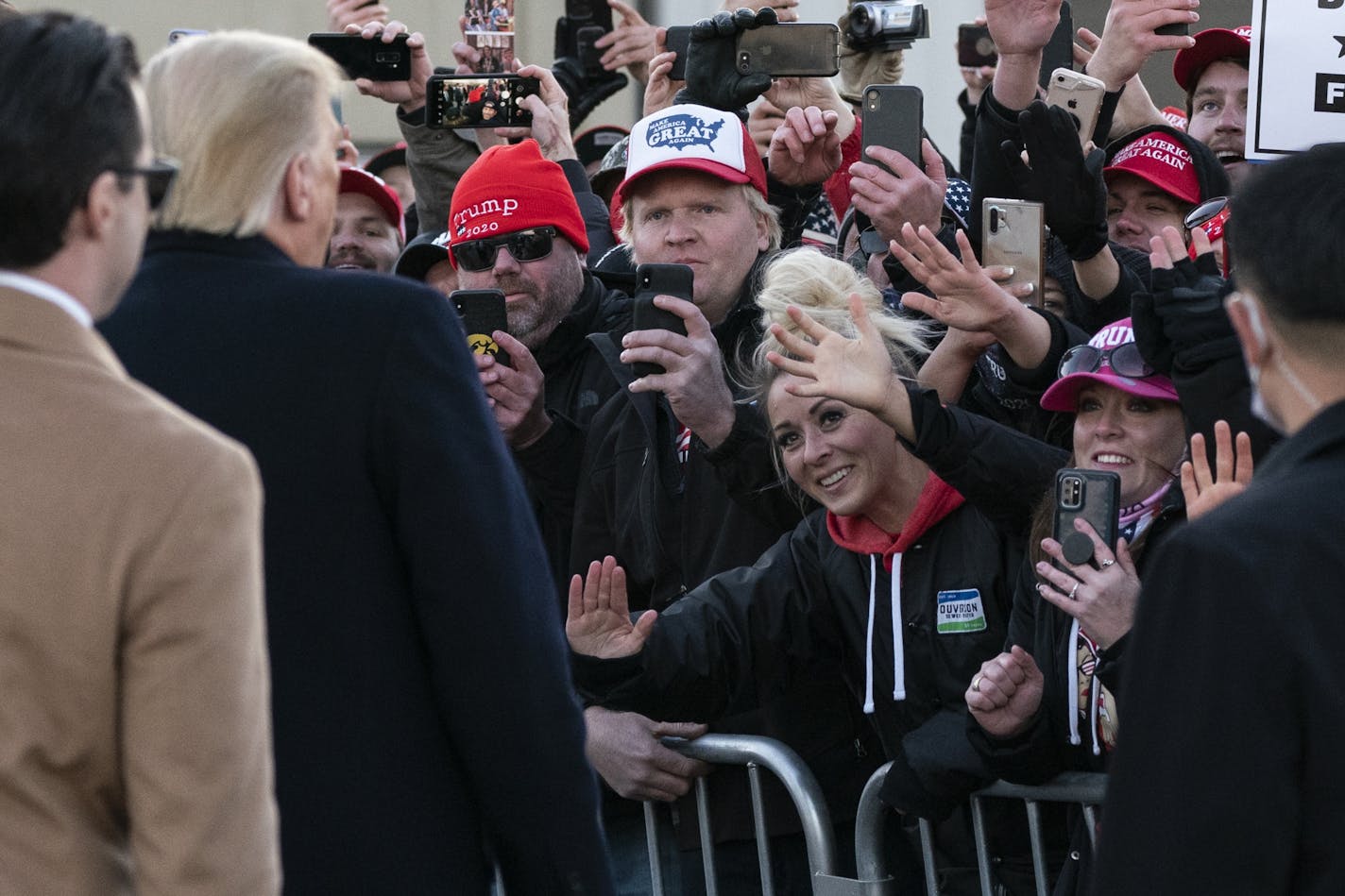 President Donald Trump greets an overflow crowd before speaking at a campaign rally at Rochester International Airport, Friday, Oct. 30, 2020, in Rochester, Minn.