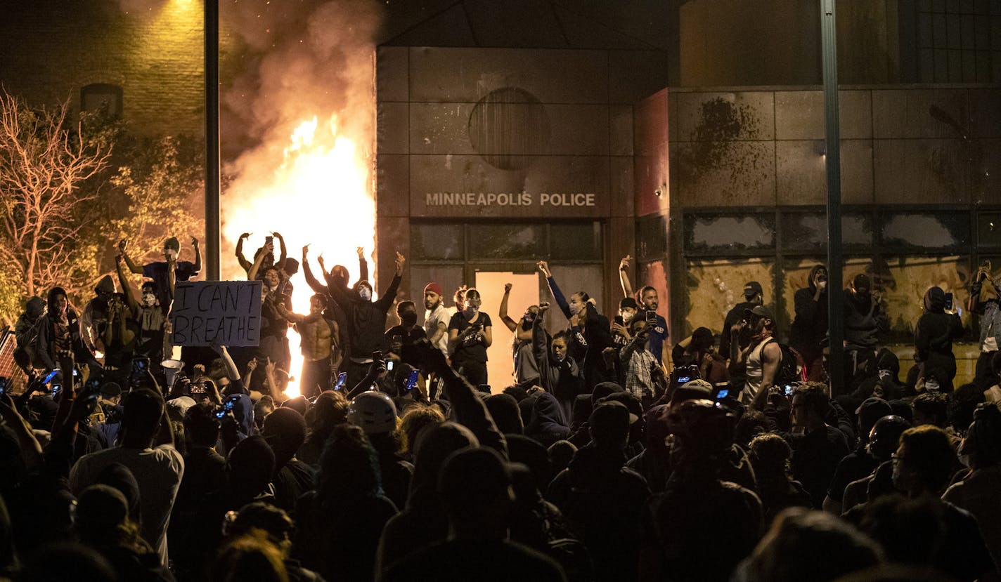 The Minneapolis Third Police Precinct is set on fire during a third night of protests following the death of George Floyd while in Minneapolis police custody, on Thursday, May 28, 2020. (Carlos Gonzalez/Minneapolis Star Tribune/TNS) ORG XMIT: 1805867