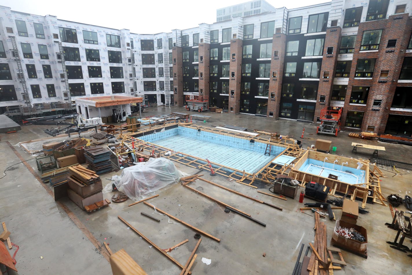 A view of the courtyard with swimming pool and whirlpool in the 25-story Expo apartment tower under construction by Doran Development Wednesday, Sept, 11, 2019, in Minneapolis.