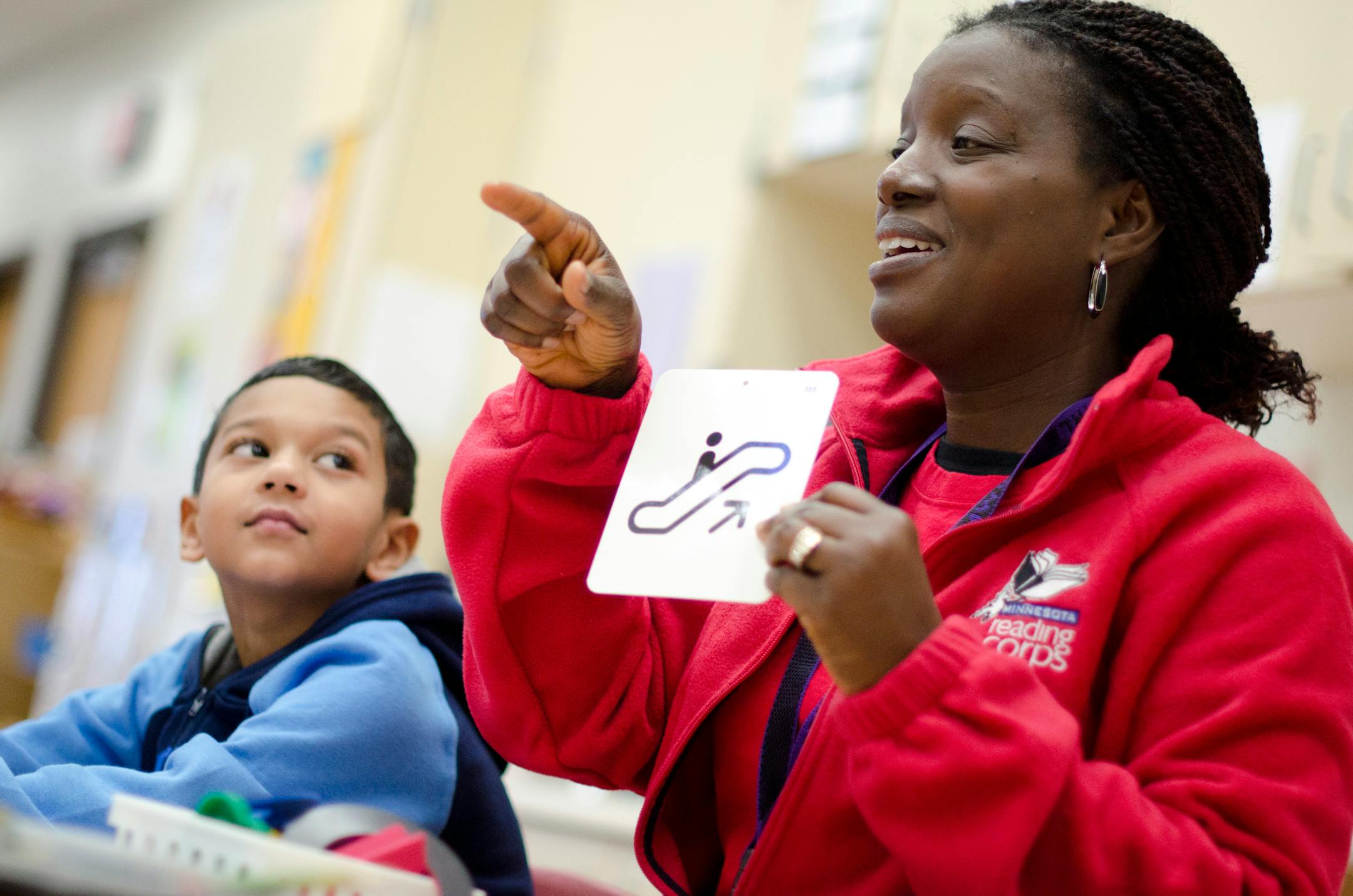 A member of the Minnesota Reading Corps helps tutor a student. Photo provided by Minnesota Reading Corps.