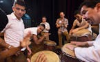 Percussionists from the Orquesta Sinfonica Juvenil del Conservatorio and the Minnesota Orchestra take part in an impromptu jam session during side-by-
