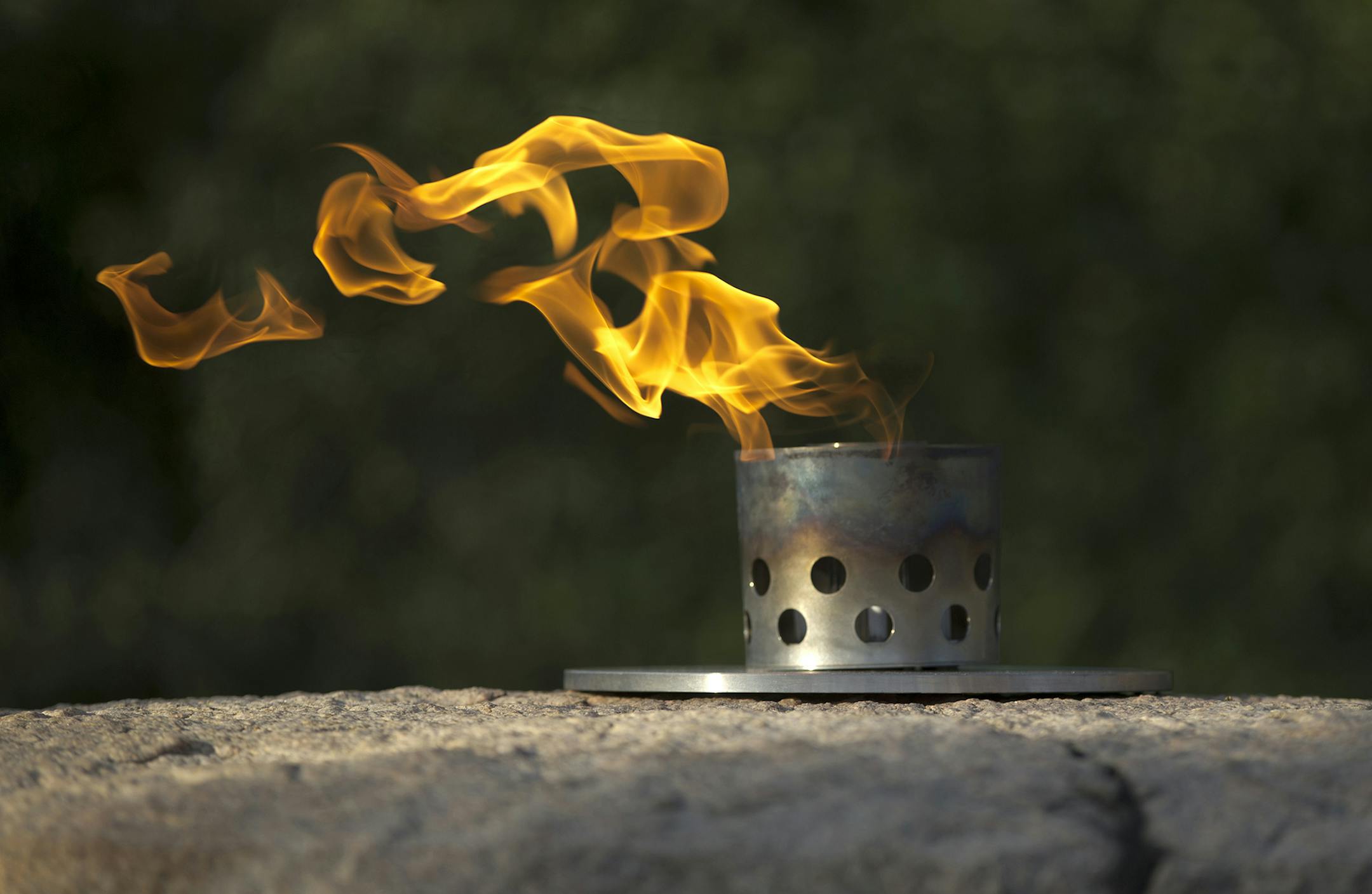 The eternal flame burns atop at the gravesite of President John F. Kennedy at Arlington National Cemetery in Arlington, Va., Tuesday, Nov. 19, 2013. Friday, Nov. 22 will mark the 50th anniversary of Kennedy's assassinated in Dallas. (AP Photo/Carolyn Kaster) ORG XMIT: MIN2013112116555949