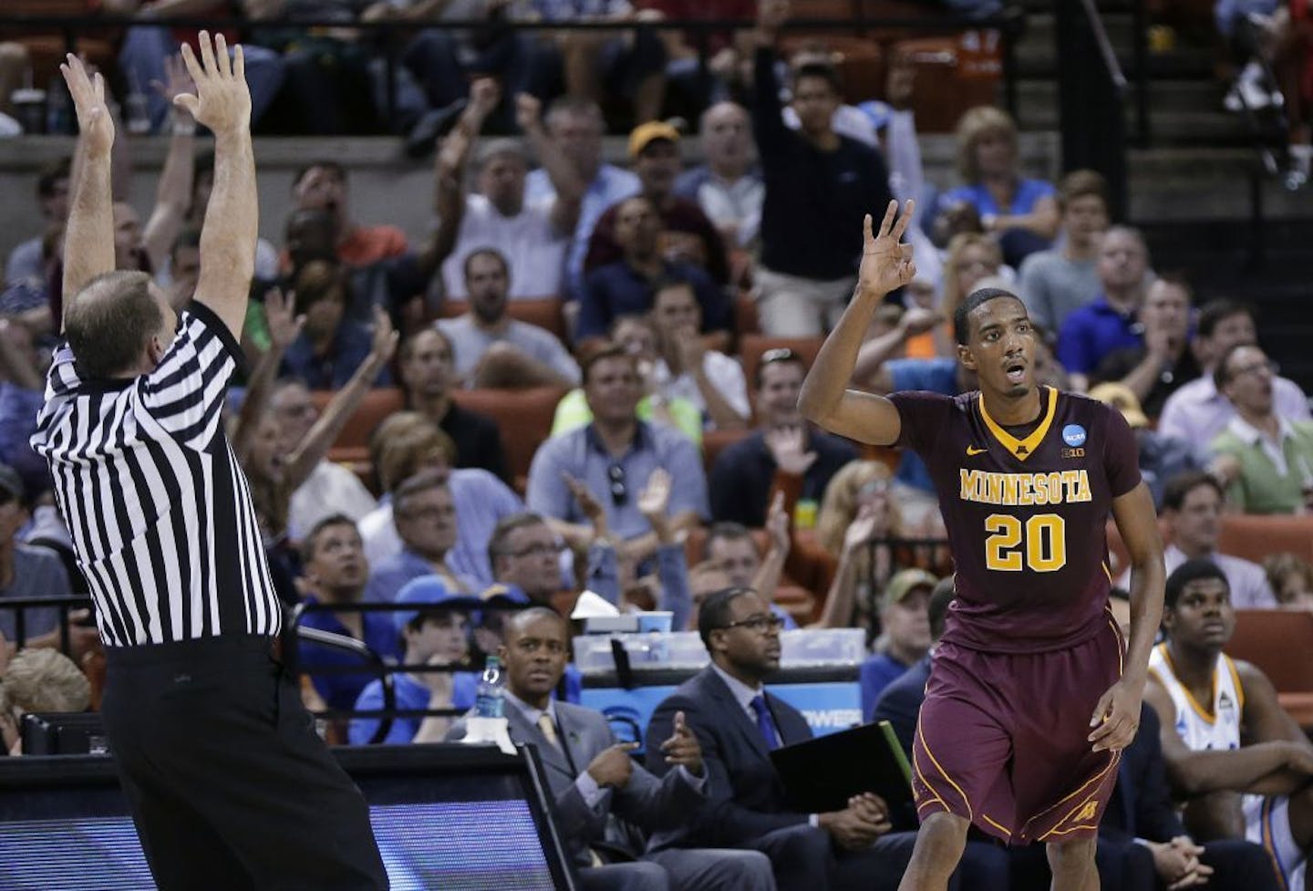 Minnesota's Austin Hollins gestures after hitting a 3-point shot against UCLA in the 2013 Sweet 16.