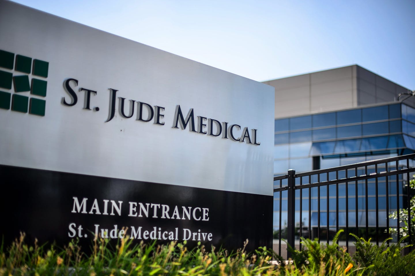 This Wednesday, July 22, 2015, photo shows St. Jude Medical corporate headquarters, in Little Canada, Minn., just north of St. Paul. Abbott Laboratories will spend $19.3 billion to buy St. Jude Medical Inc. in a cash-stock deal that aims to strengthen the medical device maker's stake in cardiovascular care, the companies announced Thursday, April 28, 2016. The combined company will offer devices in nearly every area of cardiovascular care, competing directly with industry leaders Medtronic Inc.