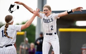 Champlin Park pitcher Marissa Rothenberger celebrates with Reese Reimler (15) after the Rebels beat the Rogers Royals 1-0 in the Class 4A, Section 5 s