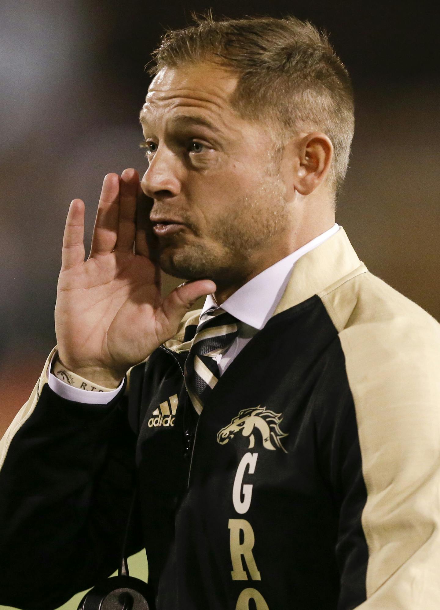 FILE - In this Nov. 1, 2016, file photo, Western Michigan head coach P.J. Fleck reacts during the first half of an NCAA college football game against Ball State in Muncie, Ind. Fleck&#xed;s team is 13-0 and is the only FBS team other than No. 1 and defending Alabama with a chance to finish the season undefeated. (AP Photo/Michael Conroy, File)