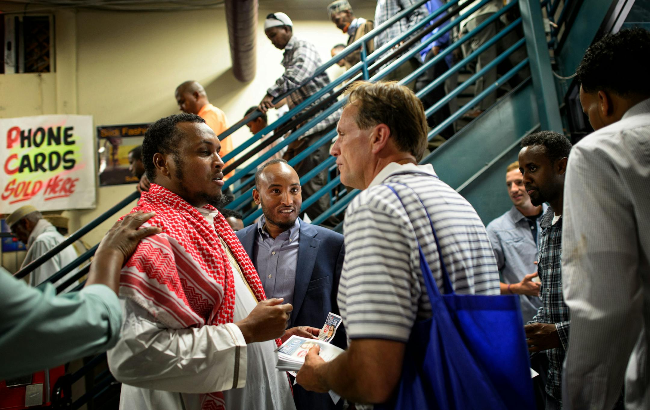 State Rep. Jim Abeler asked Somalis for their vote in the August 12 primary in his race against Mike McFadden to go up against Sen. Al Franken for the U.S. Senate seat. He handed out brochures in both English and Somali Friday after prayers at Somali Village Market in Minneapolis. ] Friday, August 1, 2014. GLEN STUBBE * gstubbe@startribune.com ORG XMIT: MIN1408011643491212