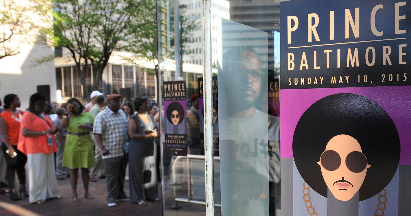 Fans line up outside Royal Farms Arena before Prince's Baltimore concert Sunday, May 10, 2015. (Jerry Jackson/The Baltimore Sun via AP) ORG XMIT: MDBAE104