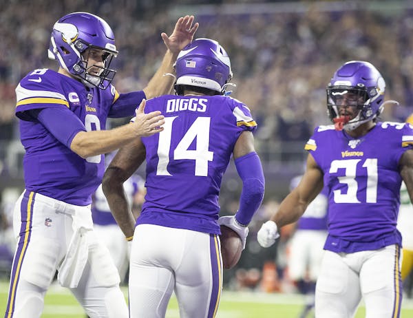 MiMinnesota Vikings quarterback Kirk Cousins congratulated Minnesota Vikings wide receiver Stefon Diggs after his touchdown reception in the second qu