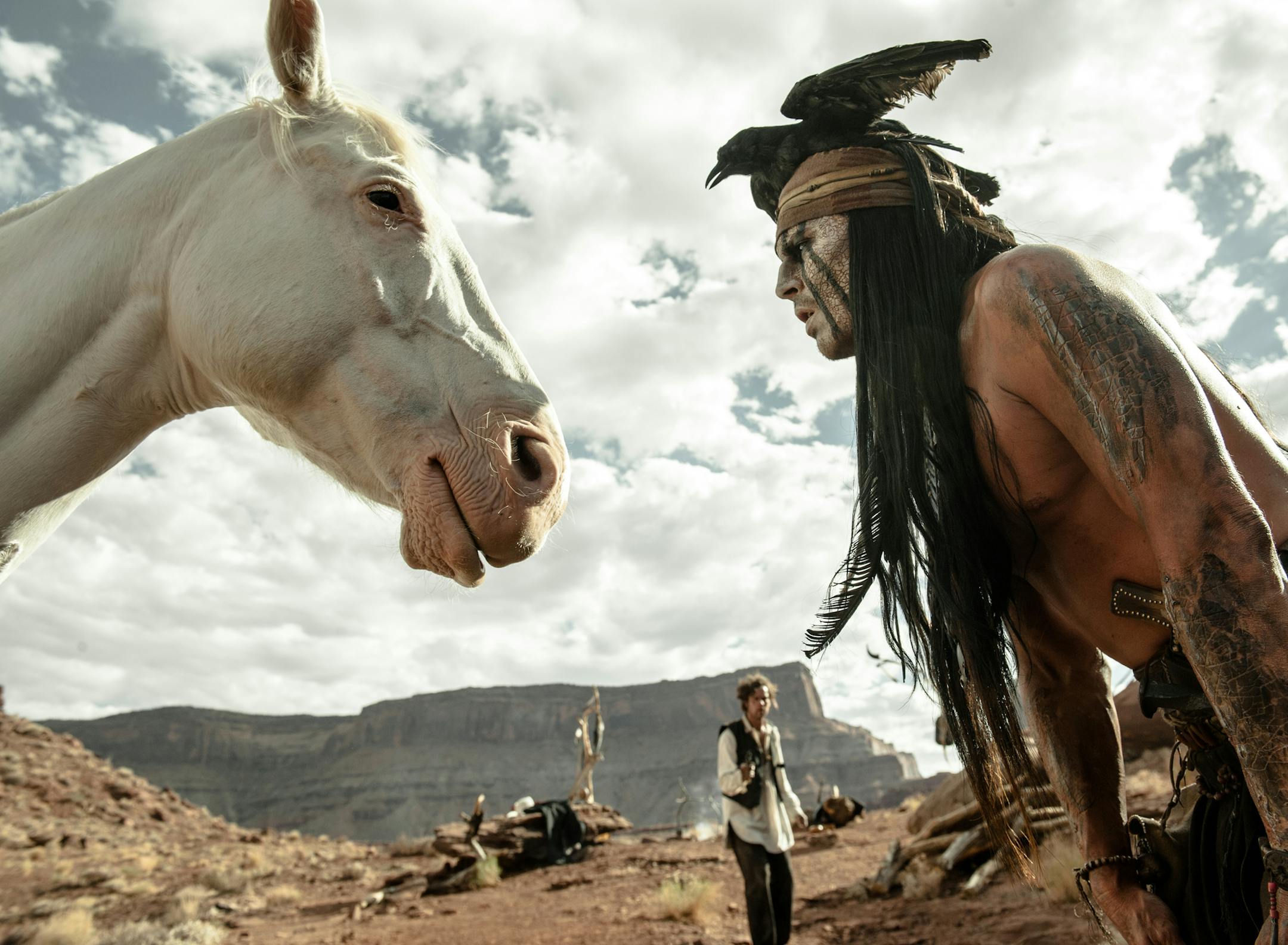 FILE - This file publicity image released by Disney shows Johnny Depp, right, as Tonto, in a scene from "The Lone Ranger." For months, questions have swirled about whether developers, activists or tribes would be willing to plunk down millions to buy the Wounded Knee National Landmark. Now thereís a new potential buyer in the mix: Johnny Depp. (AP Photo/Disney Enterprises, Inc. and Jerry Bruckheimer Inc., Peter Mountain, File)