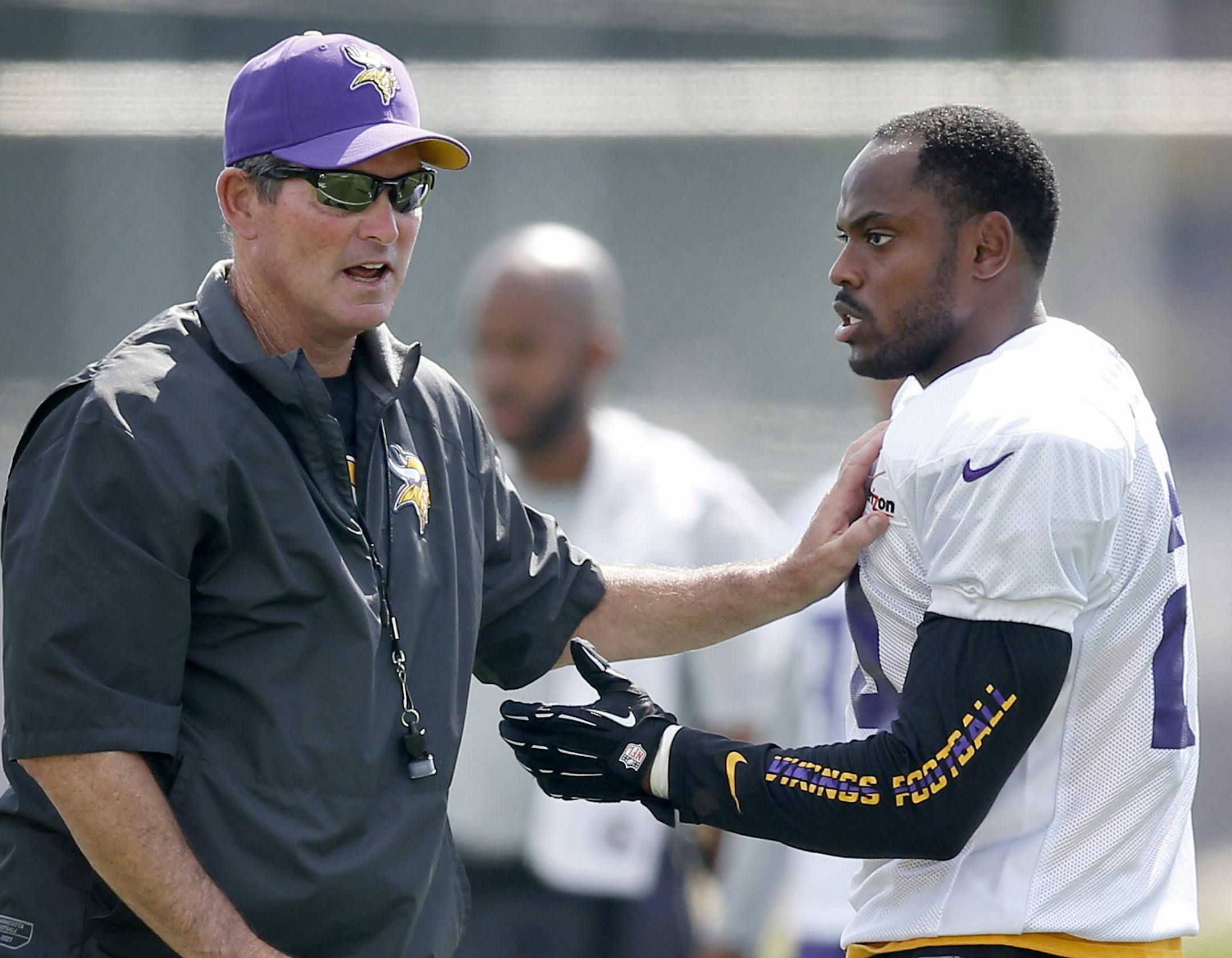 Minnesota Vikings head coach Mike Zimmer worked with Captain Munnerlyn (24) during training camp.