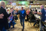 Minnesota Attorney General Keith Ellison ran towards the stage after being endorsed during the DFL state convention.