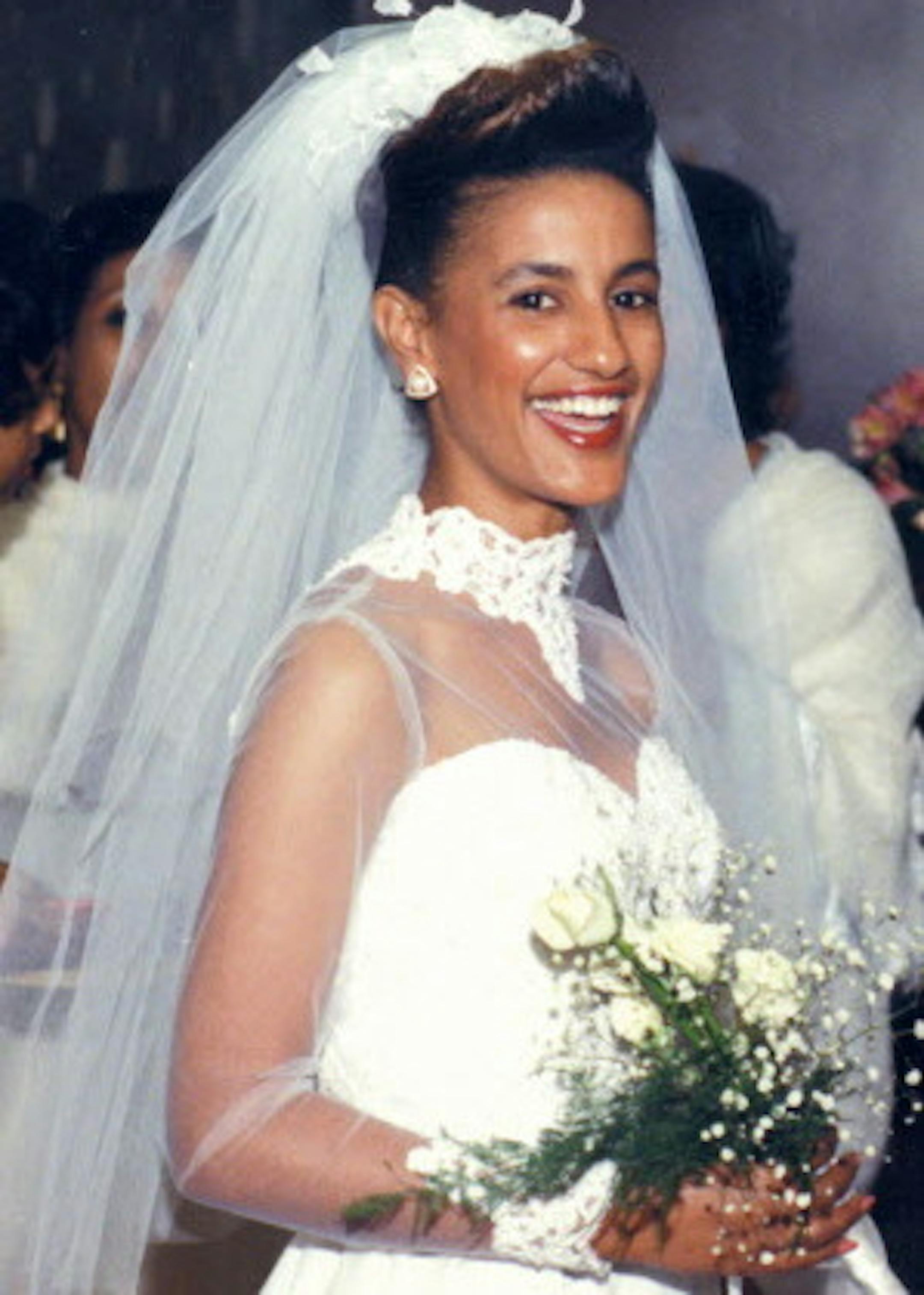 In a photo provided by Amsale, Amsale Aberra in the wedding dress she designed for her own ceremony in 1985. Aberra, an Ethiopian-born fashion designer whose simple, minimalist aesthetic transformed the modern American wedding dress, died on Sunday in Manhattan. She was 64. (Amsale via The New York Times) -- NO SALES; FOR EDITORIAL USE ONLY WITH NYT STORY OBIT AMSALE BY NELLIE BOWLES FOR APRIL 6, 2018. ALL OTHER USE PROHIBITED. --