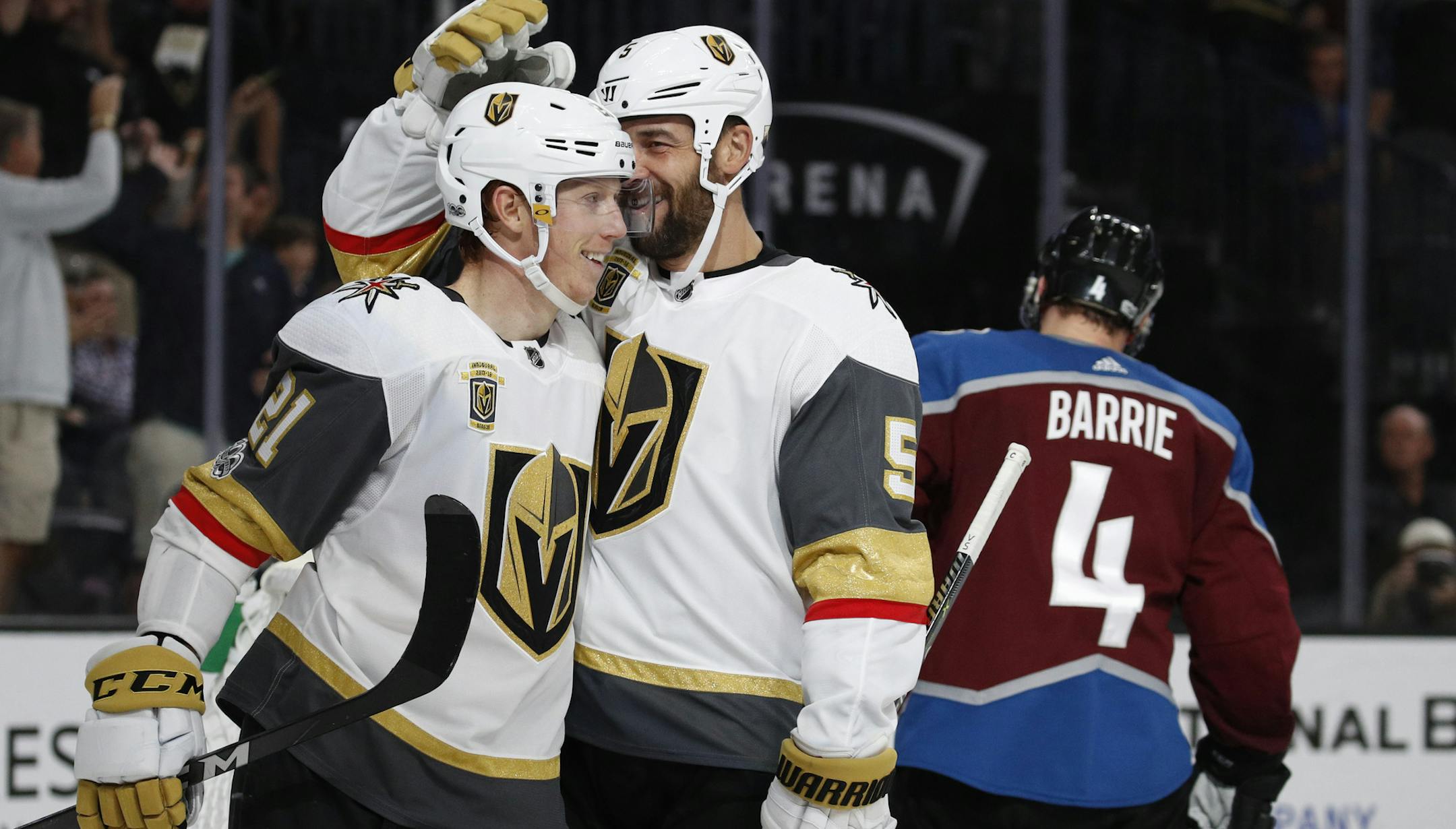 Vegas Golden Knights center Cody Eakin (21) celebrates with defenseman Deryk Engelland after Eakin scored against the Colorado Avalanche during the second period of an NHL hockey game Friday, Oct. 27, 2017, in Las Vegas. (AP Photo/John Locher)
