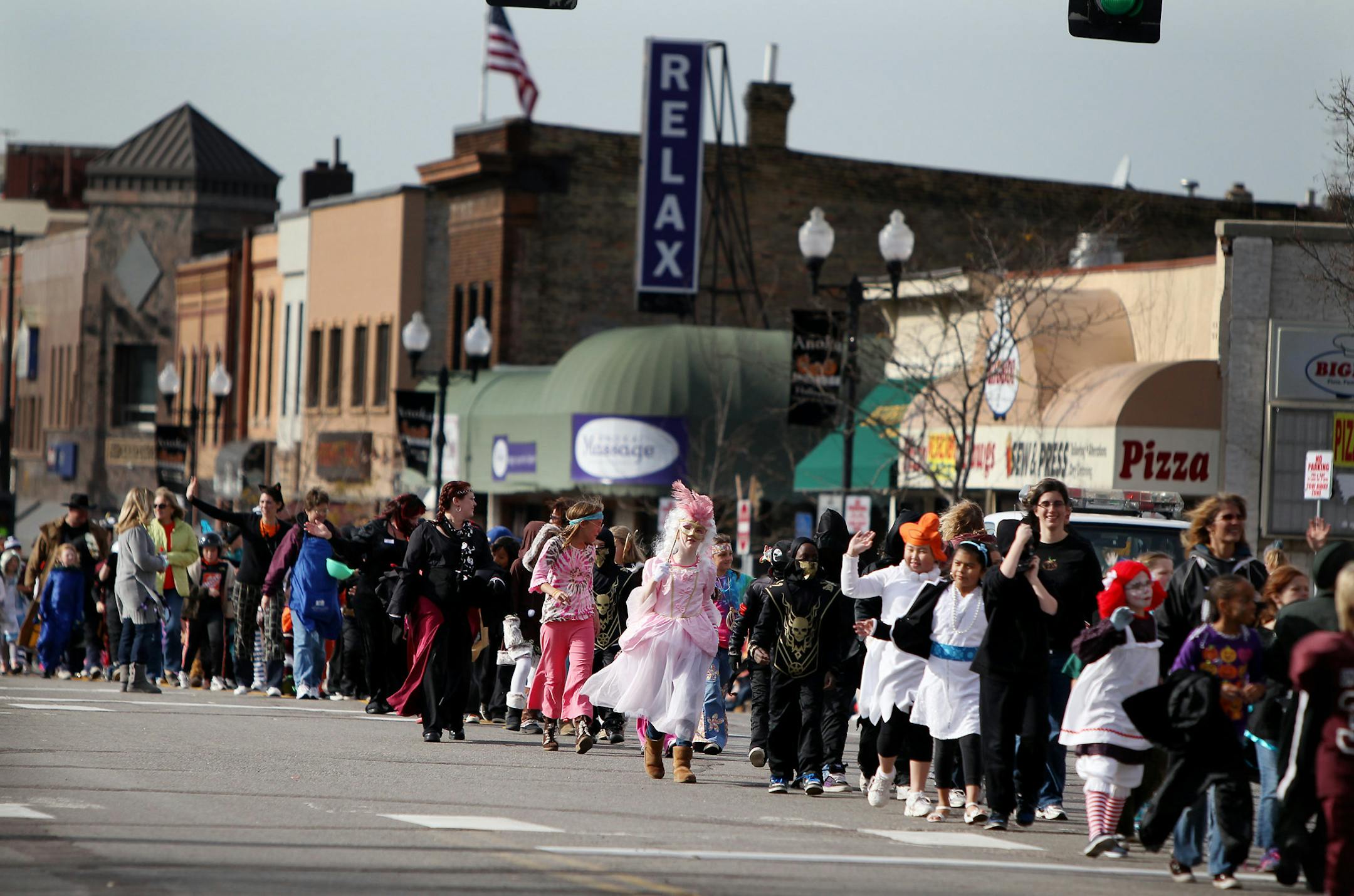 ELIZABETH FLORES ¬• eflores@startribune.com October 29, 2010 - Anoka, MN - The annual Anoka Halloween parade. IN THIS PHOTO:] Children dressed in their costumes waved in the 90th annual Anoka Holloween parade as it made its way down Main Street in downtown Anoka. The two-day parade tradition began in 1920. Anoka is known as the "Halloween Capital of the World." ORG XMIT: MIN2012102614314953