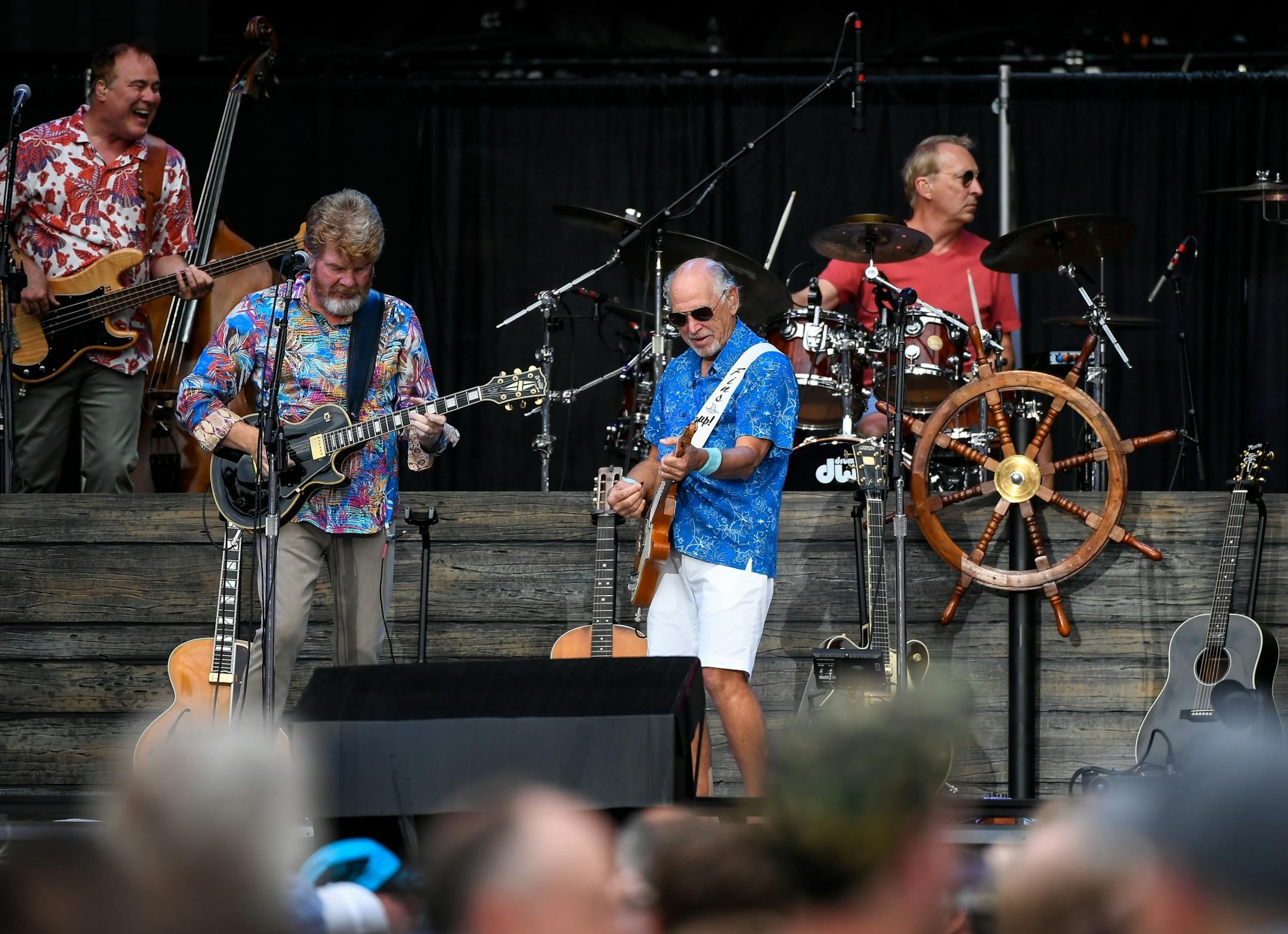 Jimmy Buffet, right of center, performed with his band Saturday night at Target Field.