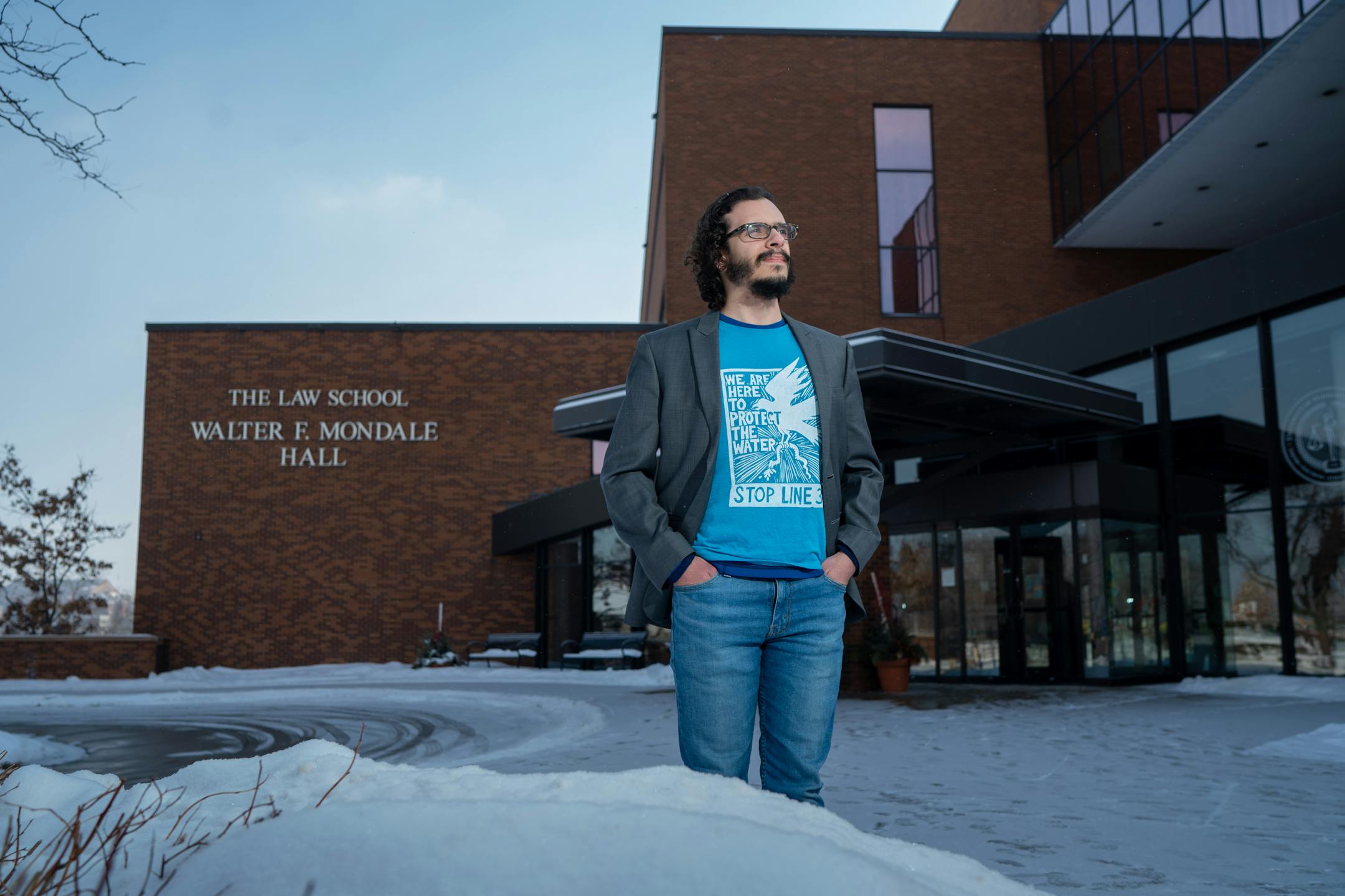 Brent Murcia, a third-year law student who is the student attorney for the Youth Climate Intervenors, a group of legal appellants in the upcoming Line 3 hearings. In front of the University of Minnesota Law School.