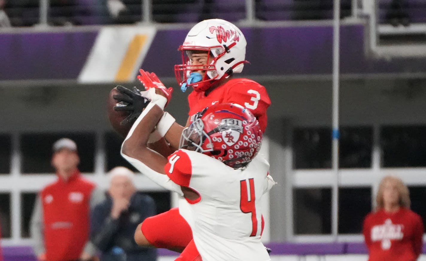 Mankato West's Jalen Smith (3) makes a catch while defended by Elk River's Darioh Balisidya (4) in the first half of the Minnesota High School football Class 5A State Championship at U.S. Bank Stadium in Minneapolis, Minn., on Saturday, Dec. 3, 2022. ] SHARI L. GROSS • shari.gross@startribune.com