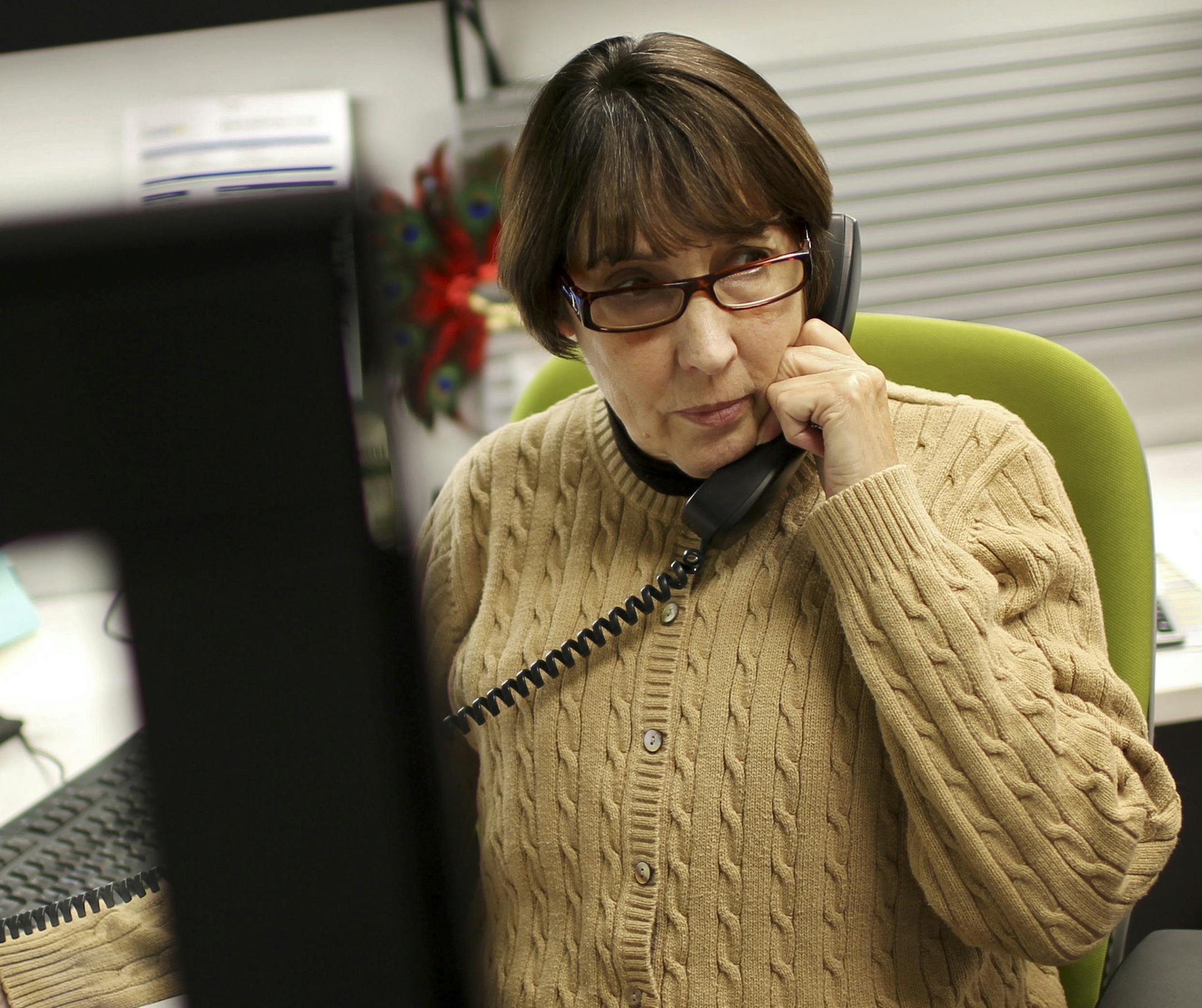 Kathleen LaFleur, who helps individuals navigate their healthcare options, on the phone at Employee Benefit Advisors of the Carolinas, in Charlotte, N.C., Nov. 26, 2013. The anxiety and the promise of revamping the health insurance system has left thousands of people in North Carolina struggling to sort out their options. (Travis Dove/The New York Times)