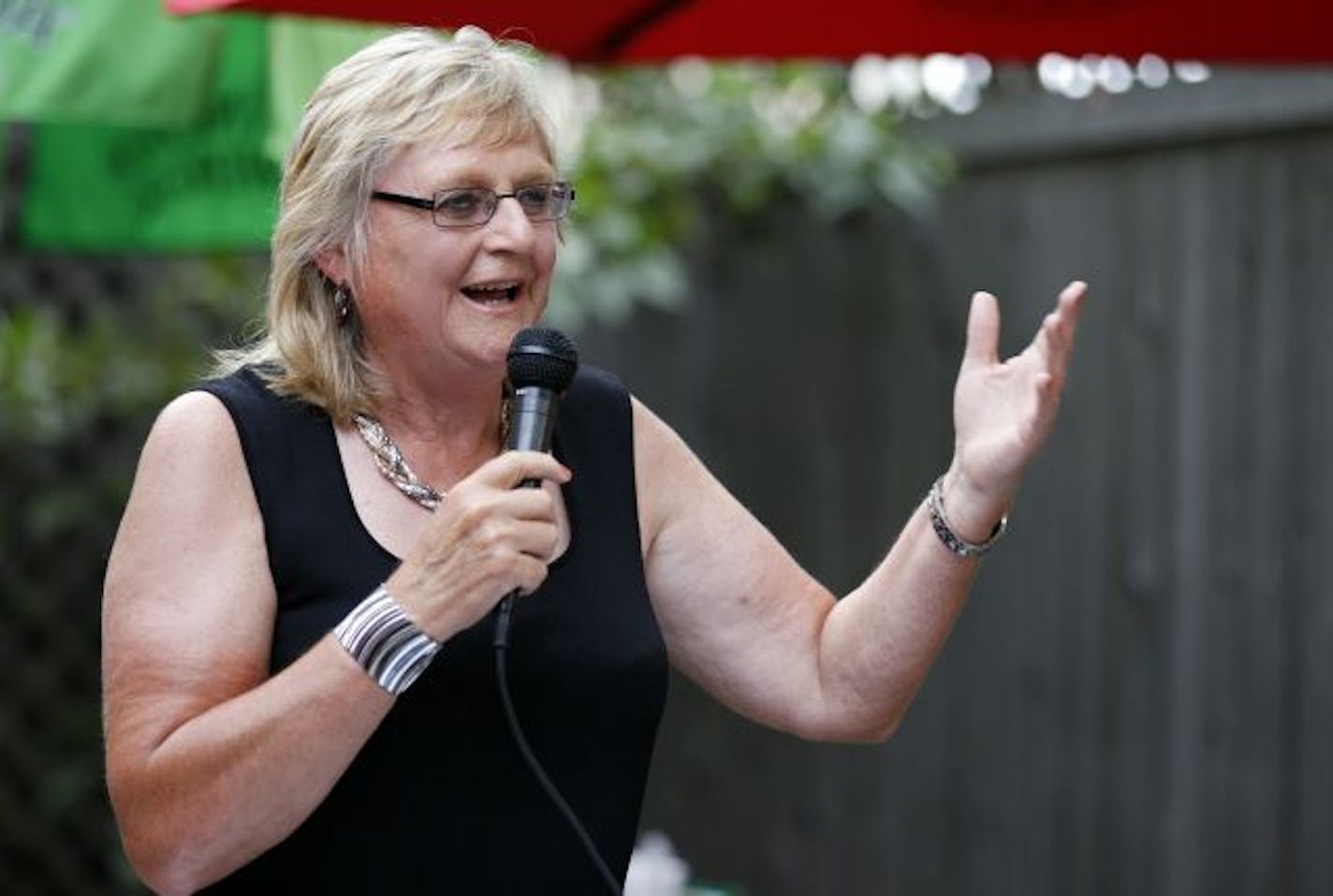 Susan Kimberly, addresses guests at her retirement part at Burger Moe's in St. Paul on Thursday. She's has been a fixture in St. Paul politics for 40 years and is retiring from her post at the St. Paul Area Chamber of Commerce.