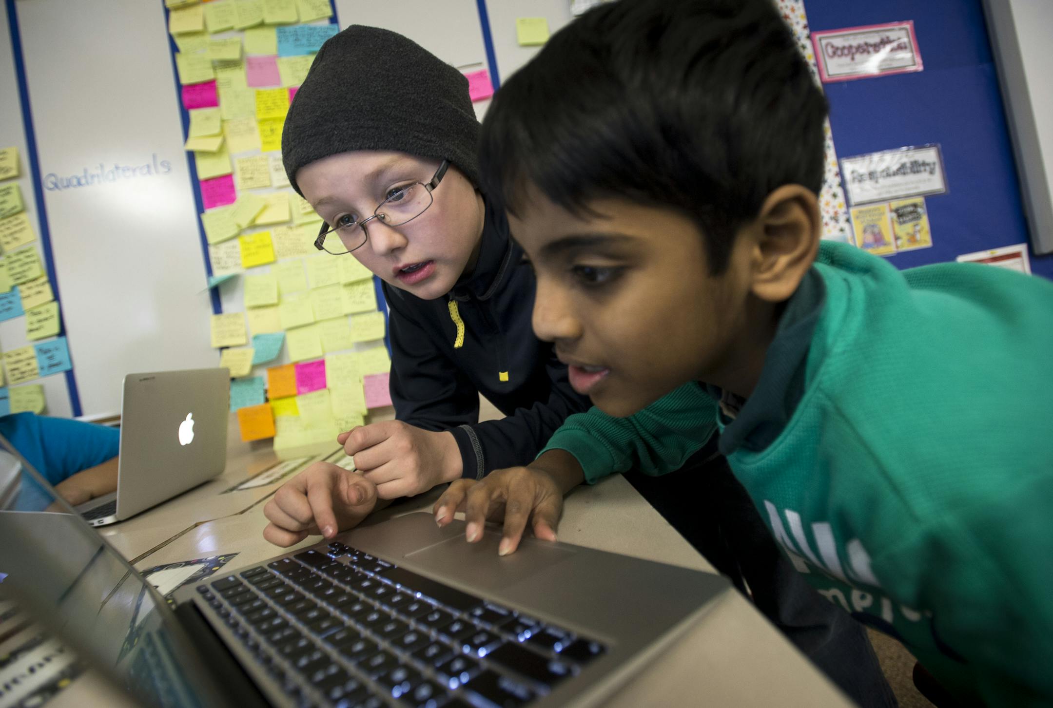 Matthew Johnson, 9, and Ganav Siddha, 8, work on Powerpoint presentations in class on Tuesday afternoon at Glacier Hills Elementary. ] (Aaron Lavinsky | StarTribune) The Rosemount - Apple Valley - Eagan district, the state's fourth largest, has been named racially isolated by the state, because they are next to less-diverse Hastings. Students at Glacier Hills Elementary were photographed during instruction on Tuesday, Jan. 27, 2015 in Eagan.