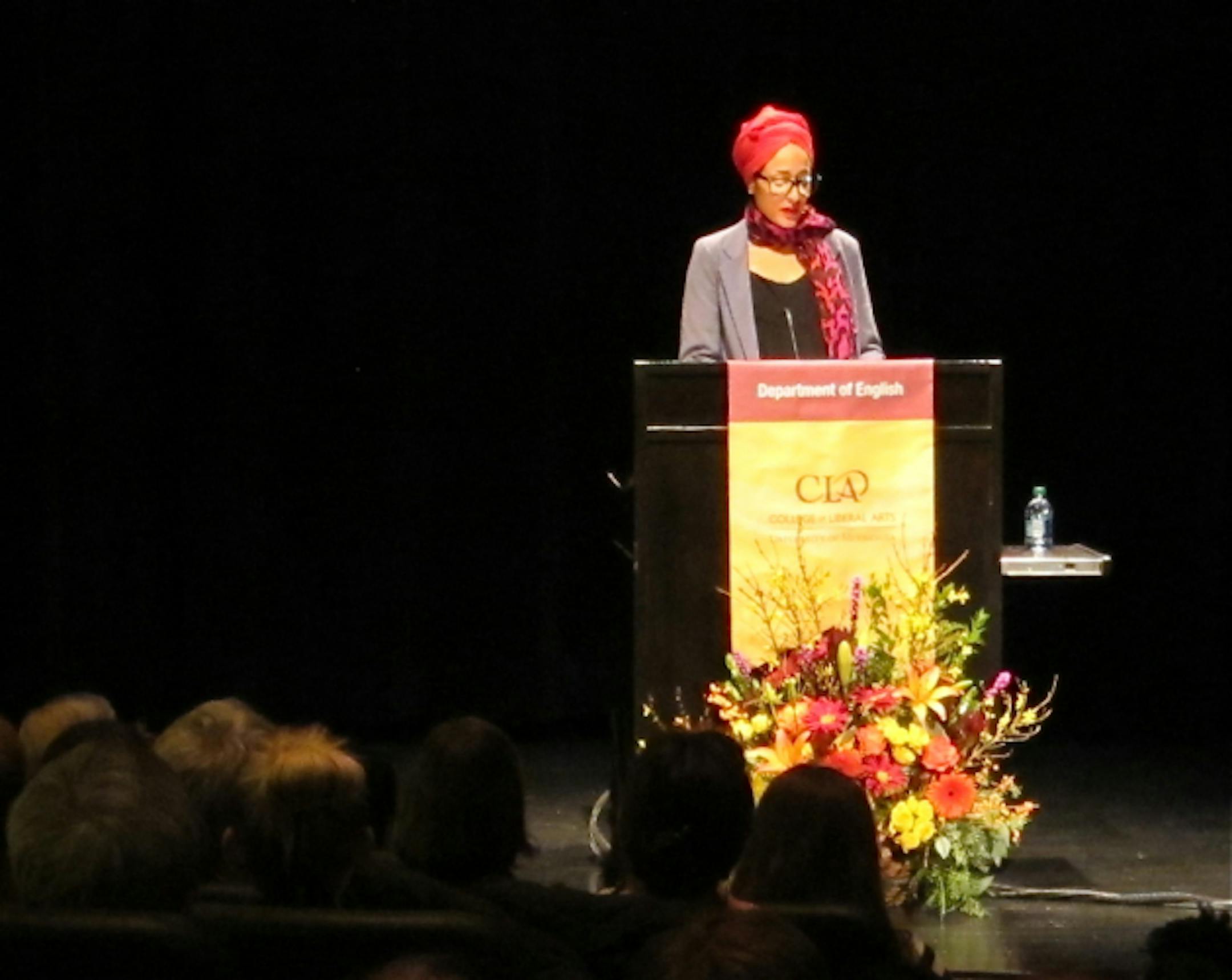 Zadie Smith speaking to an overflow crowd at the University of Minnesota.